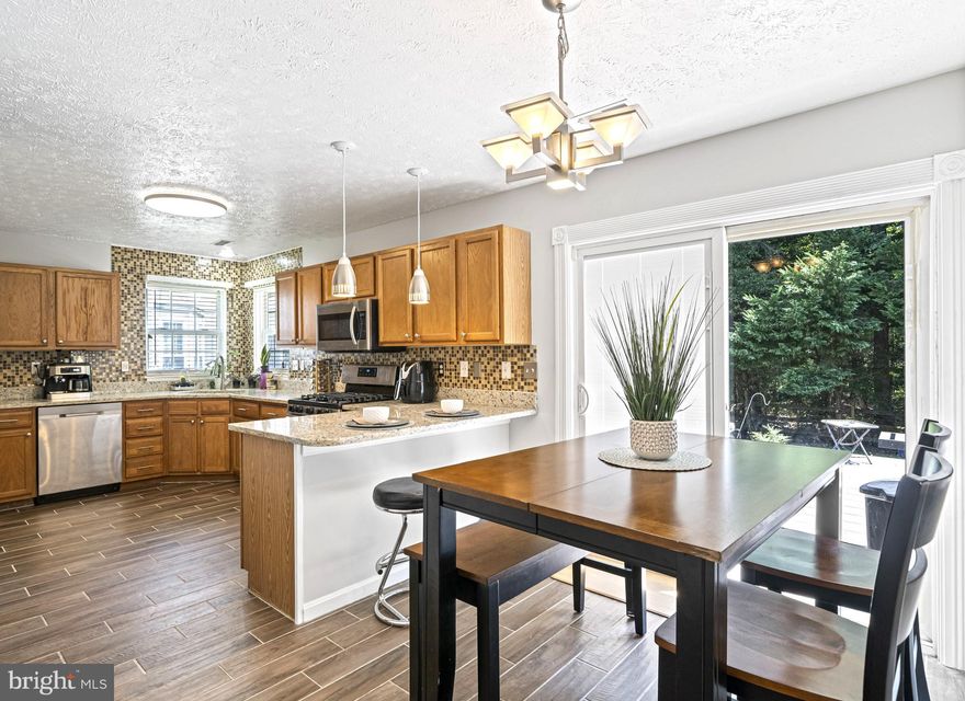 Price Improvement! One level living in the beautiful Dorchester neighborhood! Open floor plan home with three bedrooms and two full bathrooms. As soon as you walk in you will love the newly painted great room with vaulted ceiling, huge picture window and brand-new ceiling fan. Hardwood floors throughout! The kitchen is chef ready with stainless steel appliances, granite counter tops, upgraded backsplash, breakfast bar, and brand-new ceramic tile flooring. Main level washer and dryer. The dining area opens to your fenced backyard complete with spacious patio for bbqs and entertaining. The primary bedroom has a walk-in closet, and private bath with dual vanity, soaking tub and renovated glass and tiled shower. Upgraded hall full bath as well. Two car garage and storage shed! Close to shopping and restaurants. Walking distance to community pool and playground.