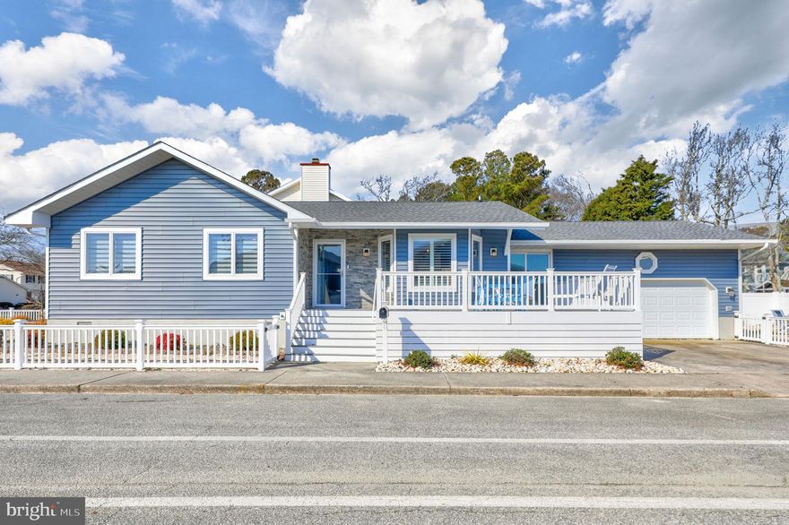 Completely renovated and updated within the past 18 months, this beautiful 3-bedroom home is ideally located just two blocks from the ocean in northern Ocean City. Meticulously designed, being sold furnished with only minor exclusions, making it a turnkey opportunity to experience luxurious coastal living. As you approach, are greeted by the inviting front wrap-around composite porch, offering a perfect spot to relax and enjoy the coastal breeze.  Step inside to discover a professionally decorated haven by Cindy C Designs, where coastal elements seamlessly blend with modern luxury. The entire home features exquisite luxury vinyl plank flooring, and plantation shutters adorn the windows, creating an atmosphere of coastal elegance. Panel blinds and zebra shades add versatility to the light and privacy control, while feature lighting and high-end ceiling fans enhance the ambiance. The heart of this home is undoubtedly the eat-in gourmet kitchen. Boasting gorgeous quartz countertops, a subway tile backsplash, and soft-close cabinets with under lighting, the kitchen is a chef's delight. Stainless steel appliances, a pantry, and expansive pull-out drawers complete the space, offering both functionality and style. The living room, with its vaulted ceiling, becomes a focal point with a floor-to-ceiling stacked stone fireplace featuring a mantel and elevated hearth. A stylish sliding barn door system leads to an amazing exercise room, complete with glass sliding doors and white ship lapped walls. The three updated bedrooms and luxury baths ensure comfort and tranquility. The primary bedroom is a retreat on its own, highlighted by an ensuite bath featuring a modern stall shower with a rain head system and a spacious walk-in closet.  Venture outside to the spacious yard, enveloped by vinyl fencing, providing both privacy and a perfect setting for outdoor gatherings. Professional landscaped to be very low maintenance with no grass to cut.  An outdoor shower adds a touch of coastal convenience. The large 2-car garage features an epoxy floor, ample storage, and a convenient laundry room equipped with a front-loading washer and dryer, along with a utility sink. Don't miss the chance to call this meticulously crafted residence your home.  Make an appointment for a private showing today!