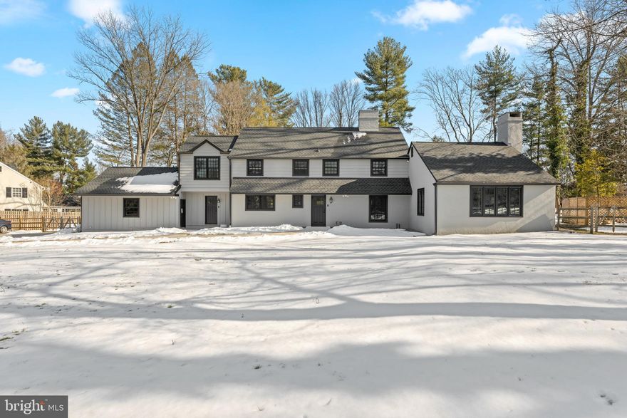 Located in one of Devon’s most peaceful and walkable neighborhoods within the award-winning Tredyffrin-Easttown School District, 130 Beaumont Road offers 4 bedrooms, 2.5 baths, and timeless Colonial architecture on a private one-acre lot. Just minutes from downtown Devon and Wayne, this home blends classic Main Line character with everyday livability in a setting that feels both serene and connected.
Step inside to a foyer rich in architectural detail. Exposed structural beams frame the staircase, while brick flooring adds warmth and texture underfoot. Substantial wood posts and authentic materials immediately set the tone for the craftsmanship found throughout. A well-appointed powder room is tucked just off the foyer, thoughtfully positioned for guests.The living room is inviting and refined, anchored by a classic fireplace and filled with natural light that highlights hardwood floors and detailed millwork, providing direct access to the covered patio - a natural extension of the home, featuring bluestone flooring, brick half walls, and exposed beams overhead. It is an ideal setting for dining, entertaining, or simply relaxing while overlooking the private rear yard.
Flowing effortlessly from the living room and adjacent to the kitchen, the dining room exudes timeless appeal with crown molding and generous proportions suited for both intimate dinners and larger gatherings. The kitchen continues the home’s character with wood cabinetry, a tiled backsplash, center island, and a large window framing picturesque views of the property. Functional yet warm, it is a space designed for both daily living and celebration.
Just off the kitchen, the mudroom and laundry area provide practical convenience with direct access to the breezeway and exceptional two-car garage, offering epoxy flooring and pull-down attic with finished flooring and a mini-split HVAC system for temperature-controlled storage.
The family room is dramatic and light-filled, with soaring ceilings, exposed beams, and an oversized wood-burning fireplace that anchors the space. Expansive windows invite in natural light, and direct access to a second brick patio expands the home’s entertaining options. Adjacent to the family room, a charming reading nook offers a cozy retreat with wood-paneled walls, exposed beams, and a fireplace — perfect for quiet mornings or evening relaxation.
Upstairs, the second floor offers privacy and comfort. The primary suite serves as a true sanctuary with soaring ceilings, two walk-in closets, and a spa-like en-suite bath featuring a double vanity, glass-enclosed shower, and soaking tub beneath bright windows.Three additional bedrooms are served by an elegant French-inspired hall bath, blending charm and functionality for family or guests.
Outside, the expansive rear yard is private and beautifully framed by mature landscaping, offering space to play, entertain, garden, or simply enjoy the quiet surroundings.
Classic architecture. Thoughtful updates. A premier Devon location.  This is Main Line living at its finest.