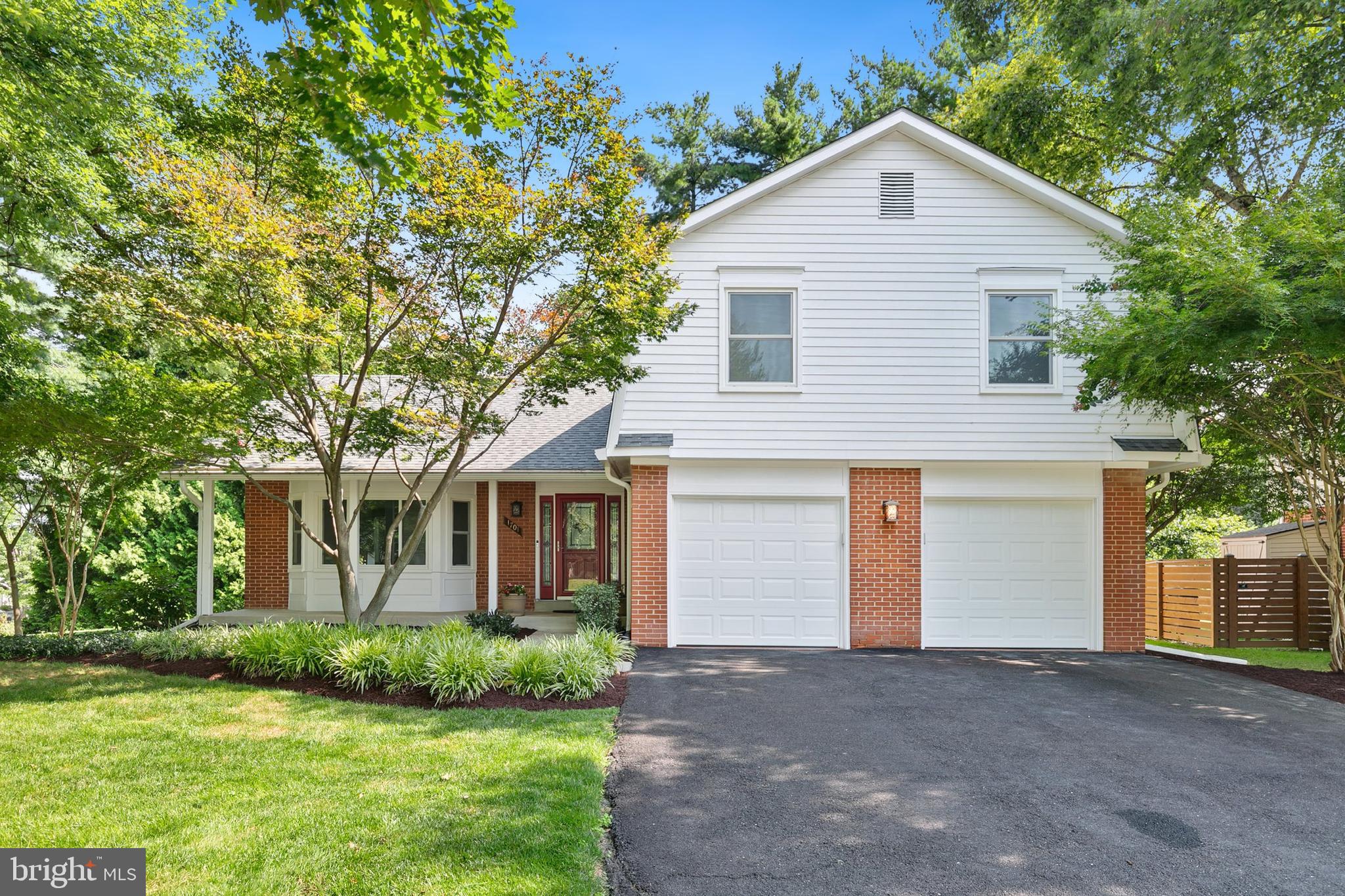 This beautifully renovated split-level home spans four finished levels and blends style, comfort, and functionality. Freshly painted and filled with natural light, it features gleaming hardwood floors and numerous thoughtful upgrades throughout. The upper level offers four spacious bedrooms with large closets, including a serene primary suite with a renovated en-suite bath (2019), dual vanities, a walk-in closet, and an additional full-size closet, plus an updated hall bath (2013). The main floor welcomes you with a gracious foyer, a sunlit living room with a bay window, a separate dining room, and a fully renovated kitchen (2021) with Samsung stainless steel appliances, Kraftmaid soft-close cabinetry, pull-out shelves, a Magic Corner, utensil drawers, and a pantry. The cozy lower-level family room boasts a fireplace, heated tile flooring (2017), a renovated powder room (2017), and a laundry area, while the fully finished basement provides flexible space for an office, gym, or playroom, with new energy-efficient recessed lighting (2025) and extra storage. Major upgrades include Lennox HVAC with humidifier (2021), Thompson Creek roof and gutters (2020, 50-year transferable warranty), energy-efficient Thompson Creek windows and exterior doors (2020, partial 50-year transferable warranty), sewer line replacement (2015), water heater (2017), and more. Nestled on a professionally landscaped corner lot, this home offers a spacious deck with updated privacy fencing (2025), perfect for relaxing or entertaining, plus a two-car garage with new doors and openers (2025). Truly move-in ready—schedule your showing today!