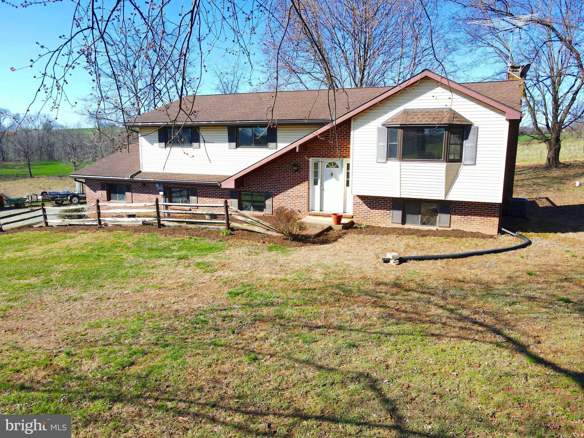 This property will be offered at Public Auction on Monday, May 12, 2025 @ 6pm. The listing price is the opening bid only and in no way reflects the final sale price. 10% down due at auction, 2% transfer tax to be paid by the purchaser, real estate taxes prorated. This secluded 4.10 acre property, nestled far off the road and surrounded by farmland, offers a 3 bedroom bi-level home, a 40’x60’ shop, and two storage sheds. The upper level features a spacious living room, a kitchen, a dining room, a master suite with a full bathroom and walk-in closet, as well as two additional bedrooms and a full bathroom. The lower level of the home hosts a large family room with a wood fireplace and access to the outdoor patio as well as an office that could be used as an additional bedroom and a laundry room. Outside, you will find a 40’x60’ insulated shop with office space, two additional storage sheds, and an outdoor deck. Additional amenities include an attached garage, and easy access to Route 472 and 222.