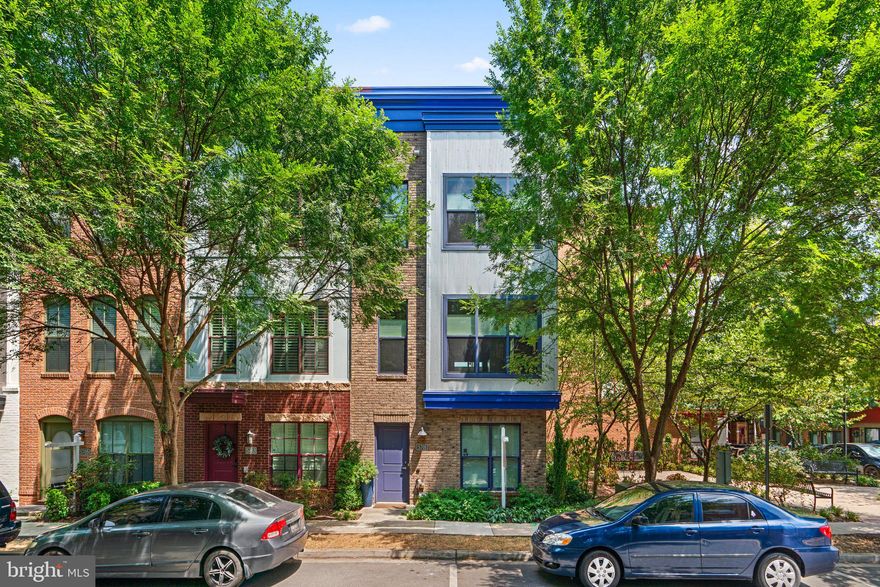 Welcome to this fantastic 3BR, 3.5BA, 4 Level, seldom available end unit Pulte "Calder" Model townhome situated in the heart of the Arts District with a "Pocket Park" right next door! Nicknamed "Skyhouse" for its views from every room, this beauty offers urban convenience and modern comfort with a contemporary flair. Natural sunlight brightens every room. Hardwood floors on all levels, recessed lighting, custom railings, central vac, upgraded noise filtering windows, easy entry into 2-car rear load garage with auto opener, remote entry and EV Charger, custom Hunter Douglas accordion shades, Rooftop Solar Installation (paid in full), decorative brick living room wall,  gas fireplace, princess balcony off kitchen, Upper level outdoor terrace, SS appliances, pantry, third floor laundry and so much more. The floor plan allows for dual home offices (entry level and uppermost level) or dual guest accommodations.

Its location is a commuters' delight as major transportation routes (495, 95, 295 & 50), two Metro stations (soon to be three with the Purple Line under construction), public bus service and the Riverdale Marc station are easily accessible. Additionally, all the amenities you could hope for (Whole Foods, 3 blocks to YES! Organic Market, more than a dozen restaurants a short distance away, outstanding hiker-biker trail, a "green artery" only one block away, connects to DC and Laurel as well as other trails, small free art gallery at Pyramid Atlantic, independent bookstore, music events, craft fairs and farmers market and The University of Maryland (offering The Clarice Smith Center for The Performing Arts and Big 10 Sports).  The HOA includes access to the Lustine Center gym, pool, business center, lounge, pool table and tot lots.  Hurry, as this won't last long!!