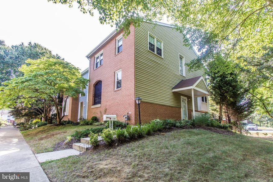 Gorgeous spacious end unit townhome w/hardwood floors through out.  Cozy kitchen with all new appliances w/walkout balcony. Master bedroom w/walk in closet and updated bathroom.  Finished lower level with a wood fireplace & plenty of storage space that leads to the backyard w/new deck for entertaining. Close to schools, shopping and restaurants, minutes from the 495 beltway!  One YR HW Included!