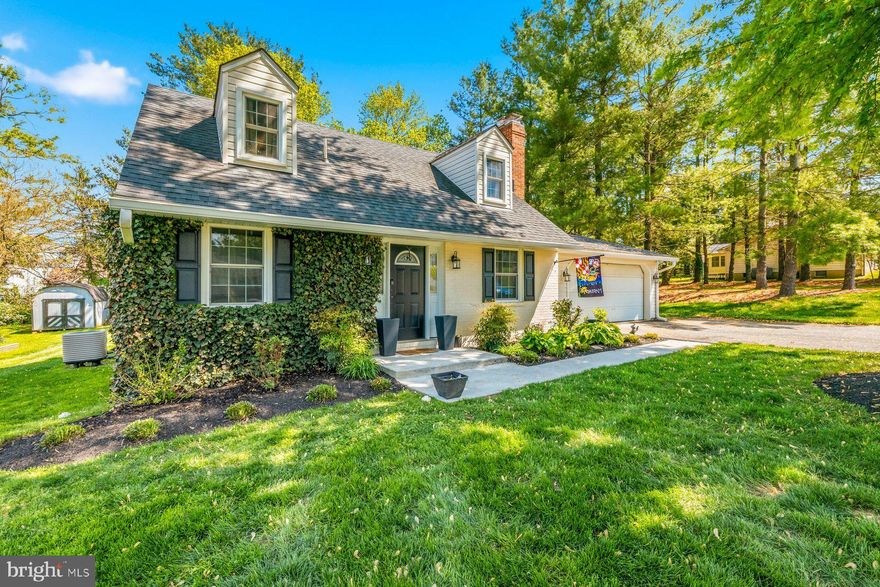 This charming Cape Cod was renovated from top to bottom with all county permits pulled in 2017 and offers quality craftsmanship and modern design throughout. The renovation included a new roof, siding, interior walls and stairways, along with all-new plumbing, and electric systems plus the current owners have added some amazing updates as well. The open floor plan showcases custom touches such as shiplap accents, 3/4" hardwood floors on two levels, and custom ceramic tile in all bathrooms and the kitchen backsplash. The main level offers an open floorplan with family room, dining room, main level primary bedroom & bath plus a powder room.  The updated kitchen features stainless steel appliances and granite countertops. The finished lower level offers additional living space with 2nd family room with a brick fireplace, office, laundry and beautifully updated full bath. Upstairs features a convenient jack and jill bath and 2 bedrooms. An attached 2 car garage includes a rear workshop and there is approximately 350 sq ft of added living space. This beautiful home is situated on a nice, level corner lot and offers a 2 car garage, plenty of off-street parking plus a shed for additional storage. Fantastic location – close to commuter routes, shopping, restaurants, library, medical, parks and Historic Downtown Sykesville. This home is move-in ready – Welcome Home!