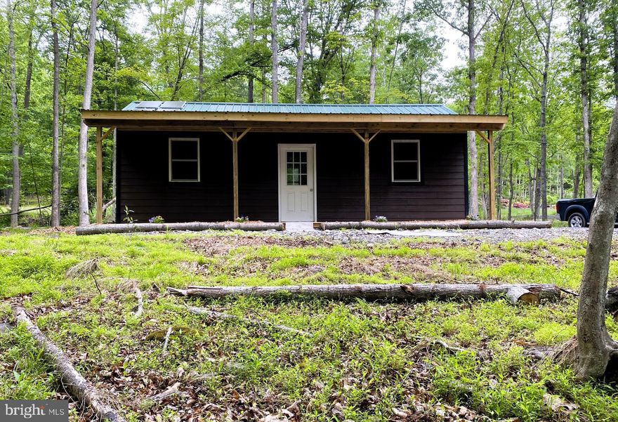 Land AND Shed/Cabin for Sale – Lot #1 with 1.42 acres located in the Cool Run Subdivision and zoned residential.  Lot #2 with 1.58 acres is also for sale directly beside Lot #1.  Seller will consider a discount if both lots are purchased.  Escape to tranquility with this parcel nestled in the peaceful Cool Run Subdivision.  This unique offering includes a charming 1-bedroom, 1-bathroom camping shed/cabin perfect for a weekend retreat or base camp for hunting adventures.  The cozy cabin features solar-power, a compost toilet, a spacious open living area, loft area (ladder on order), covered front porch facing the woods with landscaped surroundings.  On the 1.42 acres, there is plenty of space to build your dream home or keep as a getaway.  Located in a quiet, serene neighborhood close to public hunting land; compost toilet and solar fan = off-grid ready; percolation test approved (buyer to confirm); plat recorded; and mound system required for future sewage disposal.  Whether you are dreaming of building a home in the woods or simply want a peaceful weekend escape, this property offers flexibility and charm in a natural setting.   Location is close to in-city amenities yet off-grid ready.  UPMC, Downtown Cumberland, The Great Allegany Passage for Hiking and Biking, Scenic Railroad, Rocky Gap Lodge and Casino, Allegany College of Maryland, and Frostburg State University are all within minutes away.  Approximately 1 hour from Deep Creek Lake and  2 1/2 hours from the big cities such as Baltimore, Washington, Pittsburgh, and Richmond. Don’t miss this opportunity to own land with instant usability and long-term potential!