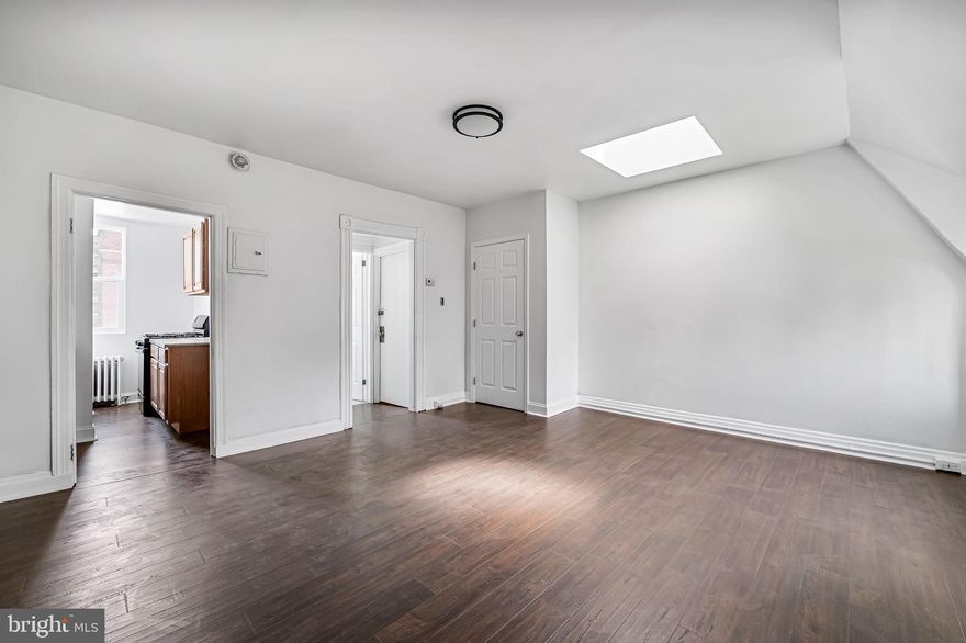 Welcome to Mount Vernon living at its finest! This unit has been updated with modern finishes including a brand new bathroom, flooring and paint all while maintaining quaint historic charm with cathedral style attic windows, arched ceilings and a skylight. Whether you're working for a local hospital, going to MICA, or just looking for a new place, this is a super affordable and charming building to be in! **TENANTS ARE RESPONSIBLE FOR** putting utilities (BGE) in their name, a portion of the water bill, and maintenance of their level (each unit has their own floor). Please apply through the link in this listing. Looking for immediate occupancy! NO pets. NO washer/dryer in-unit. This is a fourth floor walk up apartment.