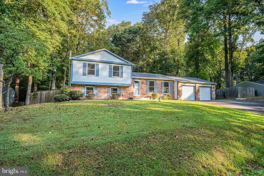 NEW WINDOWS AND ROOF, FENCED IN BACKYARD***WONDERFUL LAYOUT WITH A LARGE CLEARED BACKYARD AND BACKING TO ACRES OF PRIVACY***FANTASTIC SCHOOLS INCLUDING COLGAN HIGH SCHOOL WHICH WAS BUILT FOR OVER $113K JUST A FEW YEARS AGO****DECK, SPACIOUS OPEN FLOOR PLAN***WOOD STOVE - WELL PRICED AND JUST DOWN THE STREET FROM COLGAN H.S.