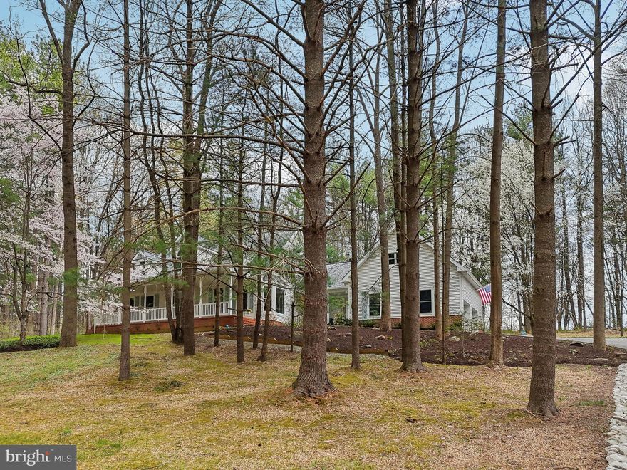 Welcome to 12132 Deer Haven Rd, a charming Cape Cod home nestled on a serene 3-acre wooded lot in the highly sought-after Spring Valley Chase community—where homes rarely become available! This stunning 4-bedroom, 4.5-bath home exudes warmth and character, featuring beautiful hardwood floors throughout and an enclosed sunroom that spans the length of the home, offering an additional 400 square feet of breathtaking views of the surrounding nature. Two finished rooms with a half bath above the garage provides the perfect opportunity for an in-law suite or a detached home office. New roof in 2021. House generator will convey as well. Original owners who picked the plans themselves have taken meticulous care of the home. Enjoy the tranquility of this private retreat while still being conveniently located near major routes, shopping, and dining. Don’t miss this rare opportunity—schedule your showing today!