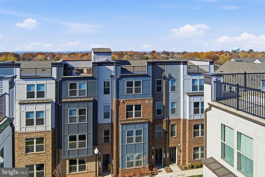 A striking new construction townhome-style condominium with a private garage is now ready for immediate occupancy.  Step into nearly 2,482 square feet of beautifully curated living, where refined finishes and timeless design create a truly elevated experience. The expansive, flexible layout offers the option of four bedrooms or a dedicated office, delivering both sophistication and versatility. A covered outdoor living terrace and an impressive oversized kitchen island provide exceptional spaces for gatherings, relaxation, and everyday comfort. The gourmet kitchen showcases premium stainless steel appliances, while the luxurious primary suite features a generous walk-in closet and a spa-inspired ensuite bath. Secondary bedrooms are thoughtfully scaled, and the home is enhanced with designer window treatments and abundant natural light throughout, offering a warm, modern, and effortlessly stylish atmosphere. Residents will appreciate high-end community amenities and an ultra-convenient, walkable location. Ideally positioned along major commuter routes with quick access to Worldgate, Clocktower, Reston Town Center, Dulles Airport, and premier dining and shopping, this home offers the perfect blend of luxury and connectivity.   Rental Requirements: No pets and or smoking permitted, minimum FICO 720, household income must be at least 2x annual rent, the lowest qualifying income will be used