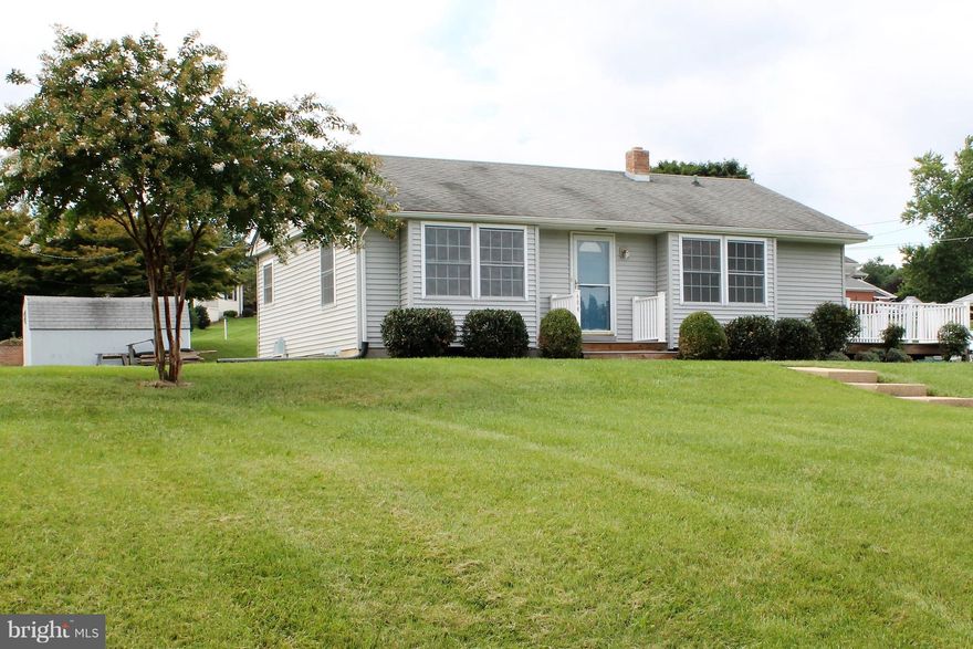 Renovated Rancher on large lot, located on a beautiful street! This home is move-in ready! Professionally painted throughout. Updated in 2012, w/ kitchen cabinets, stove, refrigerator, laminate flooring & replacement windows. Great deck on side of house, & 1 car garage facing the rear. Property has a shed that conveys as-is. Perfect first home or for those looking for one-level living.