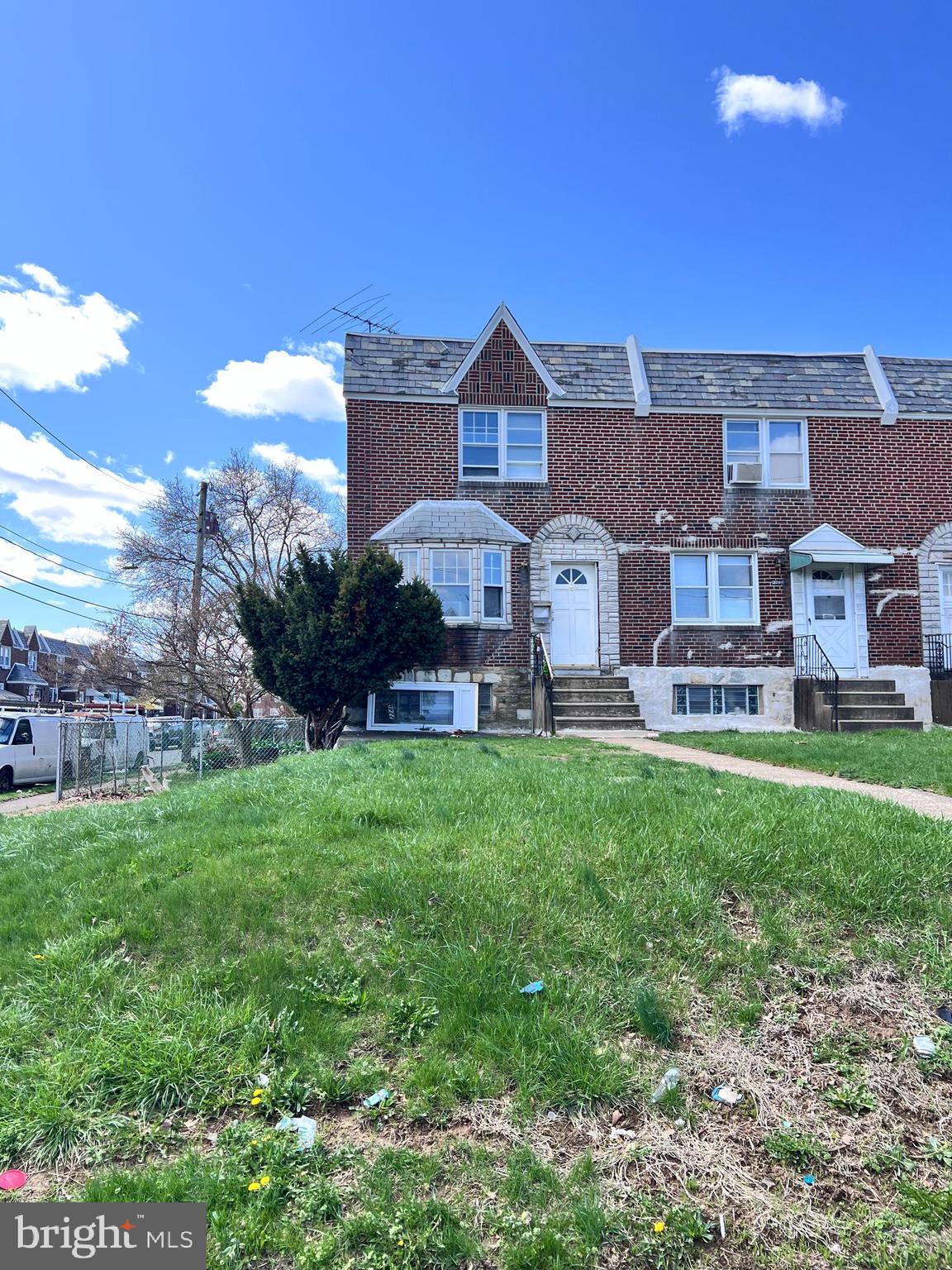18-foot-wide brick-front end of the row situated on the corner of a nice block in Castor Gardens. Arrive and you will immediately fall in love with the oversized lot and picture yourself entertaining in the front and side yards. Enter to find hardwood, laminate floors throughout. The main level features a spacious living room, formal dining room and eat-in-kitchen. The upper-level hosts 3 spacious bedrooms, all with ceiling fans and adequate closet space, as well as a 3-piece ceramic tile bathroom with shower/soaking tub combo, vanity, and toilet. The lower level has a finished basement with side doo entry, powder room, separate laundry room and exits to the 1 car garage and driveway that provides off-street parking for 2 cars. Conveniently located close to shopping, great restaurants, schools, public transportation and seconds to route 1. property needs your personal TLC.