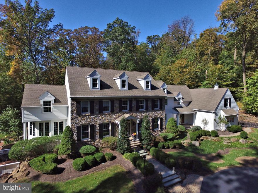 Situated perfectly in a storybook setting on Jericho Mountain in the heart of one of Upper Makefield s most sought after neighborhood locations sits this spectacular custom built Richard Zaveta stone front home. A splendid end of cul-de-sac 5.78 acre parcel, replete with long distance seasonal views, gated entry and 1/8th mile driveway, and perfectly maintained landscaping provides the backdrop for the ultimate in luxury, privacy and tranquility; a world away yet just 10 minutes to Newtown and 12 minutes to New Hope and NJ Bridges. The classic two story foyer entry reveals a gorgeous staircase with beautiful white balusters and oak treads and railing, gleaming oak hardwood floors, impressive and plentiful crown molding and millwork, fabulous floor plan and amazing views from every window throughout. To the right is the formal dining room, to the left the formal living room with beautiful built-ins and butlers pantry. The gourmet kitchen, with Wolf Six Burner cooktop, Viking Double Ovens, 48" fridge, granite counters, center island with seating for four, ample cabinet and counter space, and over-sized walk in pantry is contiguous to the large breakfast area, featuring skylights and access the spacious brick patio and family room, making this the perfect floor plan for entertaining. The gorgeous family room features 19' ceilings, open bridge overlook, walls of windows, full masonry fireplace and built-ins, and additional patio access via triple French Doors. A beautiful library with walls of windows, impressive raised paneling, large laundry room, (offering a second front entry) powder room, rear split up/down staircase, and three car garage complete the main floor. The upper level boasts a luxurious Master Suite with cathedral ceiling, two sitting rooms and two walk-in closets. The Master Bath features his/hers vanities, whirlpool tub & oversized shower. Three additional bright and airy spacious bedrooms (Princess Suite, Jack and Jill suites) with large closet spaces and plentiful storage complete the upper level. The lower level, with walkout doors to a secluded hot tub and patio area, features a full mahogany bar and kitchen, entertainment area with fireplace, additional full bath, and vast storage area. Immaculate hard and soft-scaping, back-up generator, irrigation, security system, central vacuum, 400 amp electric service, 4 zone Heat/AC, and plentiful storage are additional amenities. The home and property, located in the heart of the Council Rock School District, have been lovingly maintained, and are in impeccable mint, move-in condition.