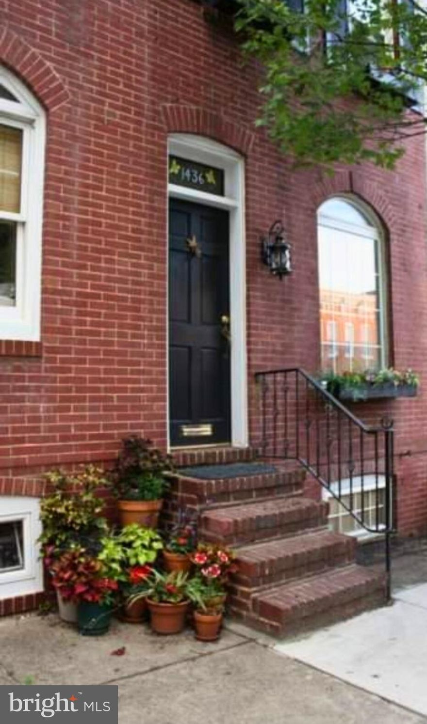 Welcome to your new home.  This quaint 2 Bedroom and 1 Bath Townhome in Federal Hill is ready for you to move right in. The open floor plan shows off the beautiful open wooden staircase . The living room has a wood burning fireplace, built-ins, and hardwood floors through out the home. Large eat-in kitchen with exposed brick and garden window over looks the brick patio retreat in the backyard.  The bedrooms have crown molding, chair rail  and  shutters along with a laundry area. Gorgeous deck/garden in this perfect Urban Oasis .  Walking distance to shops, grocery store and great restaurants. New HVAC