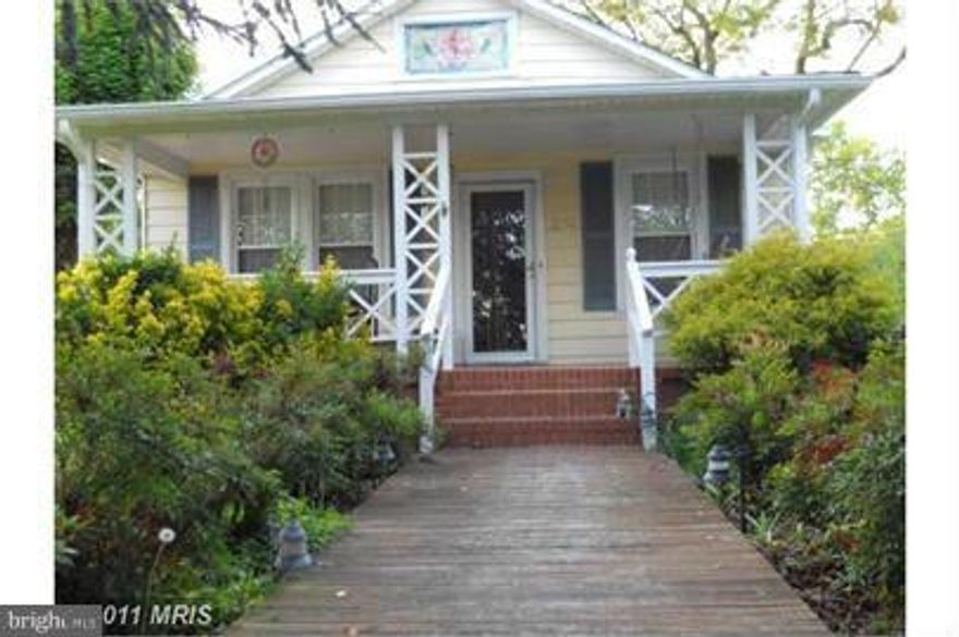 Unique and quaint home with 5bedrooms and 2.5 bathrooms.  2 main level bedrooms, large eat in kitchen with hardwood floors and ceramic tile throughout the main level.  Situated on over 1/2 acre of property and small fenced in side yard with off street parking.  This is the place you want to call home.