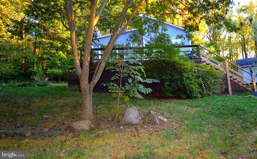 Adorable cottage 7 miles (and 15 minutes) from Rt 50 / Howesllville Rd. This 2 bedroom / 1 bath home has been nicely renovated with granite countertops and stainless appliances, beautifully tiled shower and HVAC that's less then 5 years old! Cozy up in front of the large wood burning fireplace or take in the forest scenery on the front porch. This home is the perfect blend of mountain retreat and modern convenience.