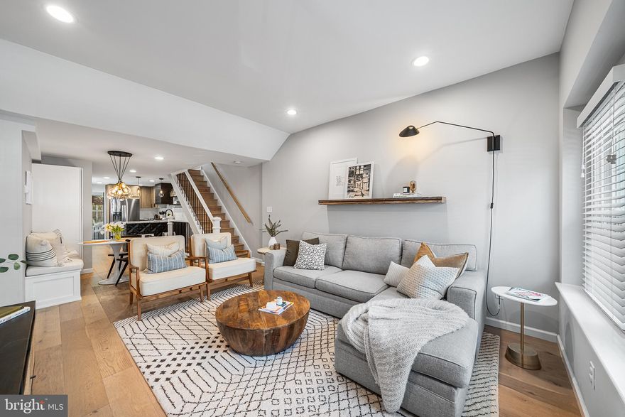 Everything has its place in this bright and carefully designed home in the heart of Fishtown! 2218 E Gordon Street is an inviting and well-kept 3 bed, 2.5 bath home. The first floor opens into a bright living area with high ceilings, recessed lighting, and exposed brick. A built-in banquette sits between the kitchen and living room - made for enjoying meals or a flexible work space, with bonus storage tucked beside. The kitchen is modern, with stainless steel appliances, a large hood, and easy access to a main-level half bath. Just behind the kitchen is a sunny bonus space lined with windows and overlooking the backyard. It's perfect for a home office, your yoga mat, or a coffee corner. Step outside to a private backyard with room for grilling, lounging, and alfresco dinners. An additional outdoor enclave has space to hold your trash cans and includes a small exterior closet. Upstairs, the rear bedroom opens to a private, second-floor deck. The full hall bathroom features double sinks, a reclaimed wooden vanity, and spacious tiled shower. The primary bedroom sits at the front of the home with exposed brick, a walk-in closet, and a second smaller closet. On the top floor is a tucked-away third bedroom with closet - ideal for a nursery or office. The finished basement offers even more options, with high ceilings, a full bathroom, and space for a workout setup, TV lounge, or guest room. You'll also find storage space and laundry in the basement. This delightful home sits just blocks from Riverwards Produce, Meetinghouse, Philadelphia Brewing Co., Picnic, and all the best of Fishtown!