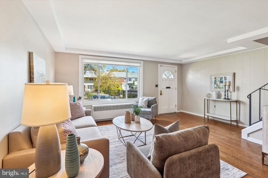 OPEN HOUSE CANCELLED  Welcome to 1420 Woodbine Street, a sunny 2-level home in the convenient Kenwood Towers neighborhood of Alexandria. This charming townhome’s main level  features an updated kitchen with stainless appliances and a utility room with stackable W/D and shelving  for storage. The generous Living/Dining area is perfect for entertaining and relaxing. The second level offers three bedrooms: a primary BR, Guest BR and an Office/Den/BR. The full bathroom for the home is located in the hall. Other details include warm-hued hardwood floors, energy efficient double pane windows, contemporary lighting and a pleasing fresh coat of paint.
The private fenced-in rear yard offers creative opportunities for gardening and relaxing just outside your back door – imagine morning coffee, grilling and /or dining al fresco on a pleasant summer night. Animal lovers will appreciate that the front yard is also fenced.
Located near neighborhood favorites like Great Harvest, Café Pizzaiolo, St. Elmos, Ramparts, Reunions gift shop, 1420 Woodbine is also convenient to the Village at Shirlington’s commercial district and Bradley Shopping Center. With close proximity to I-395, getting to Downtown DC, Reagan National Airport, the Pentagon, Amazon HQ2, Old Town Alexandria and Ft. Belvoir is quite convenient. The Pentagon and King Street Metro stations and close-by bus routes make commuting throughout the DC Metro very easy. There are a myriad of options for bikers and running enthusiasts such as the Mount Vernon Trail, Fort Ward Park and Four Mile Run Trail. Shouldn’t your new home address be 1420 Woodbine Street?