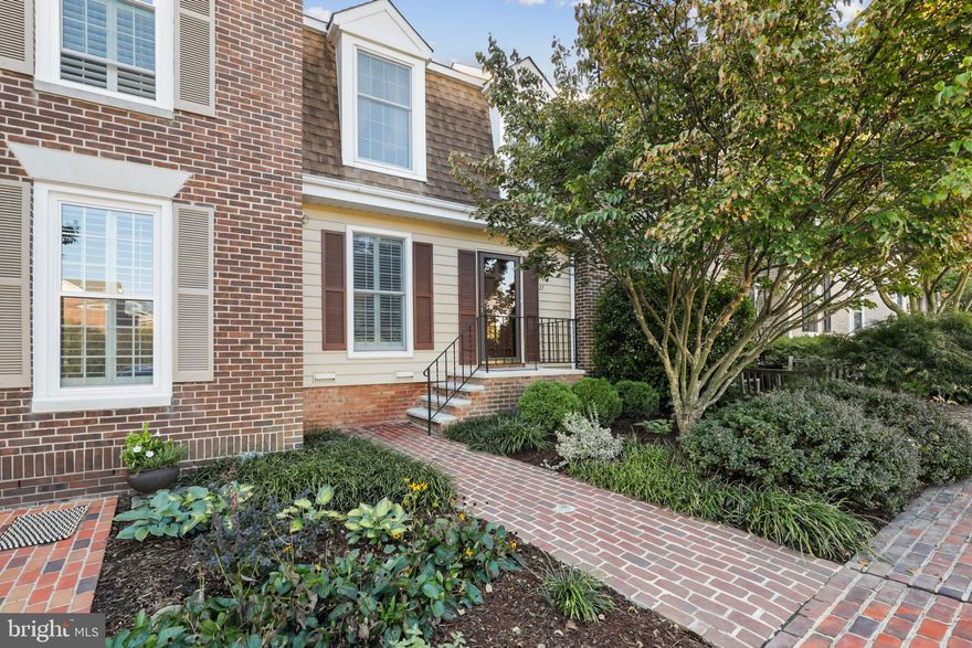 From the moment you enter this tiny community, you will realize what makes Stevenson Mews so special.  A charming brick walkway leads you into the entrance hall of this sophisticated townhome.  Your eyes will immediately be drawn toward the updated sliding glass doors off the formal living room to the spacious Trex deck.  Gleaming hardwood floors enhance the entire first and second floors.  A few of the many upgrades include crown moldings and chair moldings, an updated cook’s kitchen with granite counters, stainless appliances and plantation shutters.  The first floor also provides a powder room.  The second floor boasts crown moldings, hardwoods, ceiling fans in both large bedrooms, double closets and an abundance of natural light.  The large bath offers two sinks and dressing area.  The lower has a large recreation room with a wood burning fireplace, sliding glass doors to a private patio and garden.  This level has a laundry room, bathroom, and storage space.   Two assigned parking places also come with the property.  Within close proximity, you will find top rated schools, shopping, dining, parks, and public transportation.