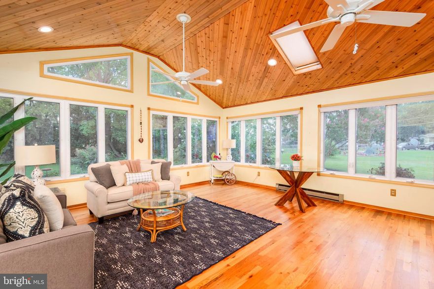 MARLING FARMS -Waterviews of Crab Alley Bay - PRICE REDUCED -Brick Rancher- All on ONE LEVEL - Beautifully landscaped 3/4 acre lot that backs to trees - fenced patio area - 2 bedrooms with lots of windows and large closets - 2 full baths, one with a tub, one with a walkin shower - fabulous sunroom addition - quiet office area - updated kitchen with granite counters, newer cabinetry, beverage center with wine frig, large laundry area, large pantry closet, water conditioning system was just replaced, front load washer and dryer,  money saving solar system in place (leased), gas fireplace in the living room with large mantle, large shed in backyard - 2 car garage with remote garage door openers and RV electric hookup. Marling Farms offers water access including a boat ramp and 4 beaches for residents to enjoy with playgrounds, pavilion, kayak storage, piers, ramp and breathtaking views. Residents enjoy walking and biking on the neighborhood streets. HOA fee is only $100 per year.  This is the lifestyle you have been looking for.  OPEN SATURDAY 1/3, 10am-12pm