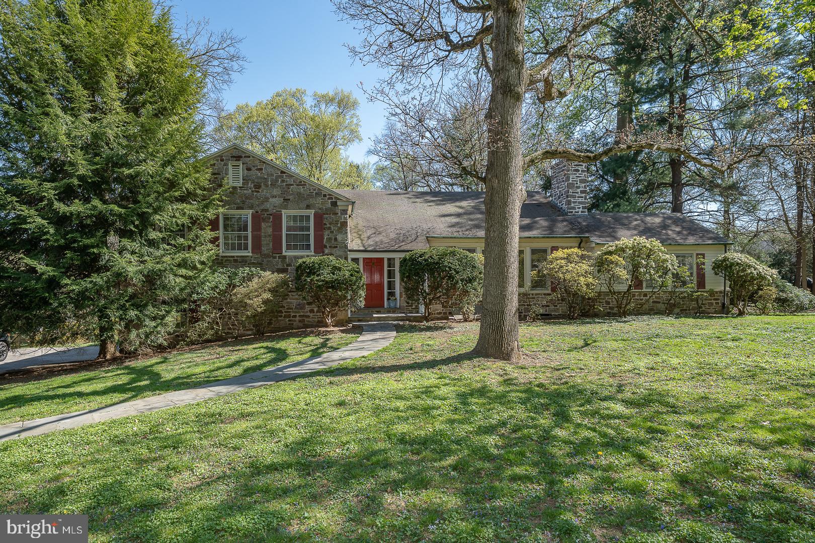 Beautiful Bryn Mawr split level in Lower Merion Township near Harriton High School.  Situated on .81 acres this 1958 modernist Mahoney built home has been freshly painted and hardwood floors refinished.  Walk into the center hall and be welcomed by an expansive sunny great room with fireplace and picture window.  Continue to a comfortable study with custom built-ins and a door to the flagstone terrace that overlooks a private back yard with plenty of room for you to add a pool.  To the left of the living room is a dining room with a wonderful view of the rear property.  Adjacent to the formal dining room is the eat-in kitchen with another door to the rear  patio.  The entire main level has a fun flow which is great for entertaining and allowing for plenty of brilliant light.   The lower level is ideal as an in-law suite/office and has  a fireplace, half bath a door to the  side yard and access to the  large two car garage and basement.   The upstairs has a primary bedroom suite  with bathroom  and  two additional bedrooms with a hall bath.  There is ample storage in the expansive attic and basement.   Your initial impression of this home is the  privacy and peaceful walking family neighborhood.  This charming  property is in a sought-after location and has tremendous potential.  Come and imagine your unique additions and personal touches to make this house your home.  In this low inventory market, it will sell quickly.