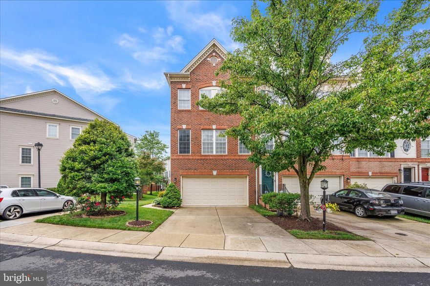 This beautiful brick front, end unit townhome offers three levels with over 2,000 finished s.f. —complete with a two-car garage and fully fenced backyard.

The entry level features a supersized recreation room with a French door walk-out to a private patio, perfect for entertaining or relaxing in the fully fenced back yard. This level also includes a convenient powder room with ceramic tile floors, and direct access to the garage.

Upstairs, the main level shines with hardwood flooring throughout a large, light-filled living room, a formal dining area, and a sunny bonus room with sliding doors leading to the deck. The kitchen is the focal point with a large center island breakfast bar, granite countertops, and stainless steel appliances.  A conveniently located powder room with designer touches completes this level.

The upper level hosts the primary suite with vaulted ceilings, a walk-in closet, and a private en-suite bath featuring a dual-sink vanity, soaking tub, separate shower, and access to a private balcony. Two additional bedrooms also offer vaulted ceilings and share a beautifully remodeled hall bathroom. A dedicated laundry room completes the level.

This superb townhome is conveniently located across from Waugh Chapel shopping center, and is nearby to many major commuting routes to Baltimore, D.C., Fort Meade and Annapolis.  You won't want to miss this one!