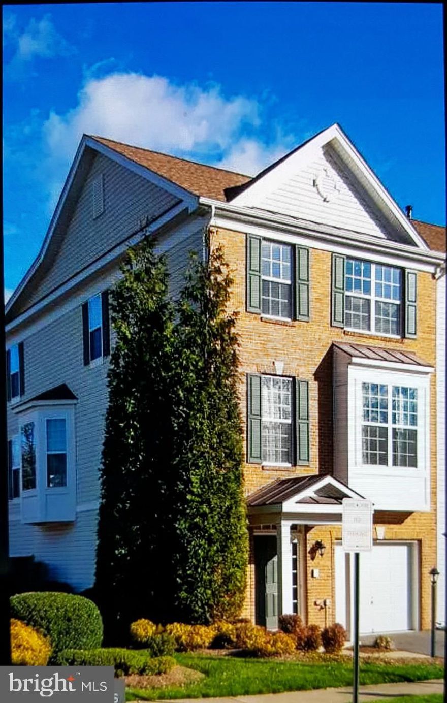 Beautiful  light filled  end unit professionally landscaped Town Home  Former model home with all the upgrades.  Minutes to I 95(both 140 and 143  exit),  Shopping . Gourmet kitchen with S S appliances ,Gas   fireplace in living room, Master BR with deluxe bath with jetted tub and closet  organizers.  Gas fireplace  in  living room  and lot more.