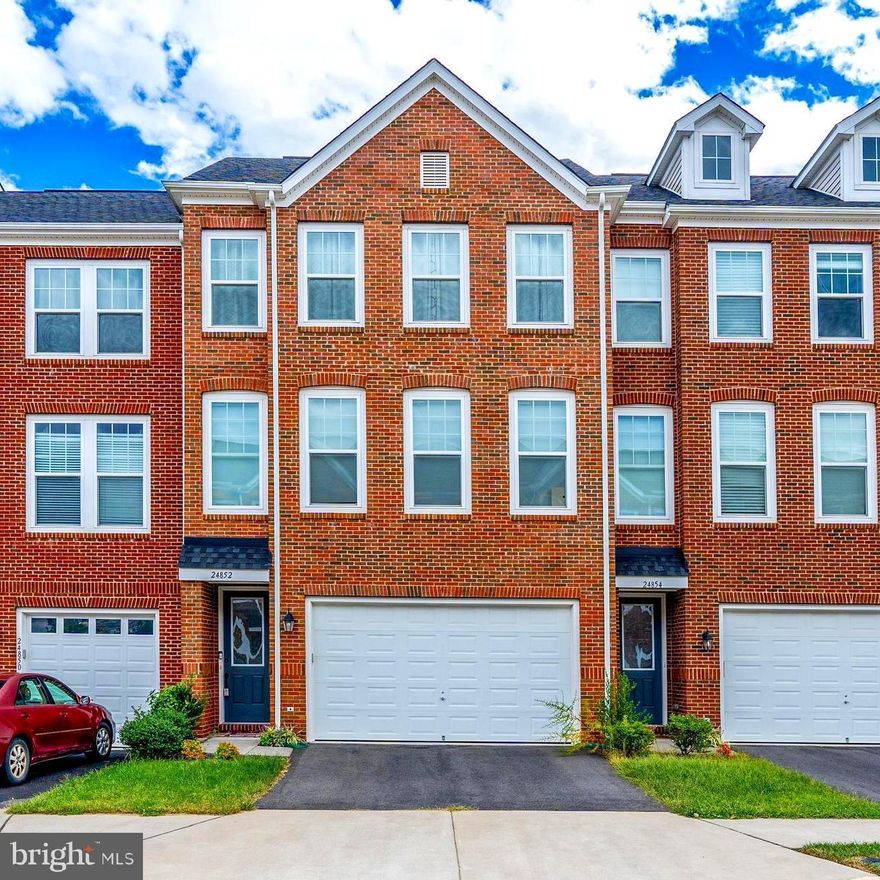 Exquisite move-in ready luxurious, beautiful three levels, 24" wide townhouse with three beds and 3.5 baths (2,610 SF), brick front townhouse in highly sought after Eastview at Stone Ridge. This stunning, nearly 7-year-old home ( 2nd time to rent) boasts an open-concept layout with gleaming hardwood floors and modern finishes that flow throughout. The gourmet kitchen features an oversized island, sparkling granite counters, a tile backsplash, and allspice cabinets. Enjoy cooking with all stainless steel appliances, including a gas cooktop, modern vent hood, and built-in wall oven and microwave. There is plenty of space for the whole family to gather around the family room, dining area, or outside on the deck! The upper level boasts 3 spacious bedrooms with two modern bathrooms, including a private master retreat. The luxurious master is a true retreat with a tray ceiling, walk-in closet, and spa-like bath featuring dual vanities, a soaking tub, and a glass shower. The upper-level large front-load LG laundry is super convenient and is close to the bedrooms. The sunny entry level features an additional full bath and family room with a gas fireplace that walks out to the truly private backyard. The spacious two-car garage with a long driveway has plenty of room for storage and parking. Community amenities include access to pools, trails, and playgrounds. Excellent location just minutes from Rt 50 for easy commuting access to the Dulles Toll Rd, 28, and Dulles Airport.