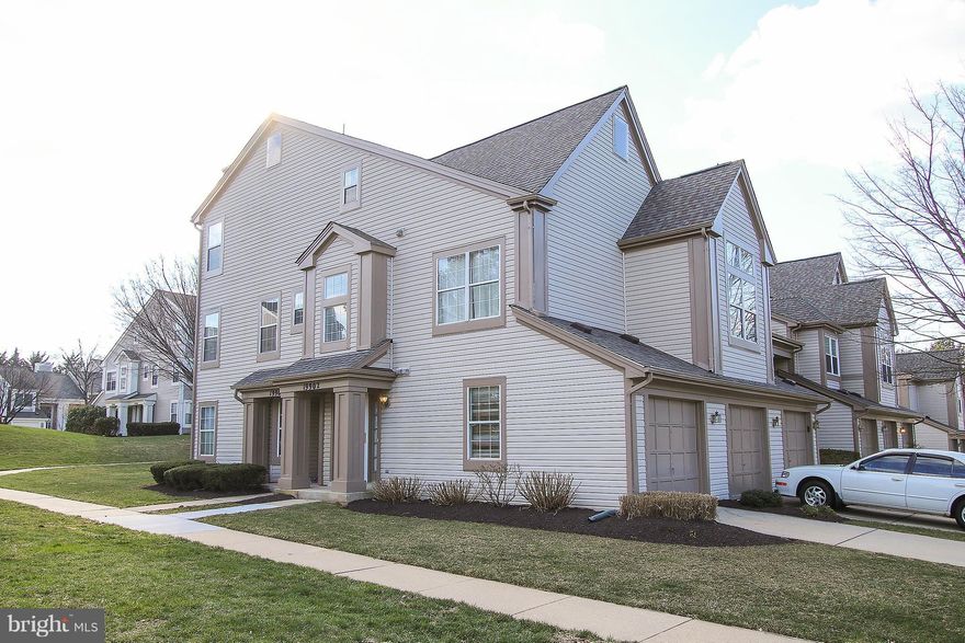 Gorgeous end unit TH w/garage 2BR, 2.5BA.  All new hardwood floors.  Sun drenched livingroom w/Wood burning fireplace, spacious deck, eat in kitchen plus dining area, DUAL master suites w/Cathedral ceilings & full bath each.  Ready to entertain family & friends. Full size washer & dryer on BR level.  All exterior maintenance done by Association. Close to shopping, I-270 & MARC Rail, nature trails.