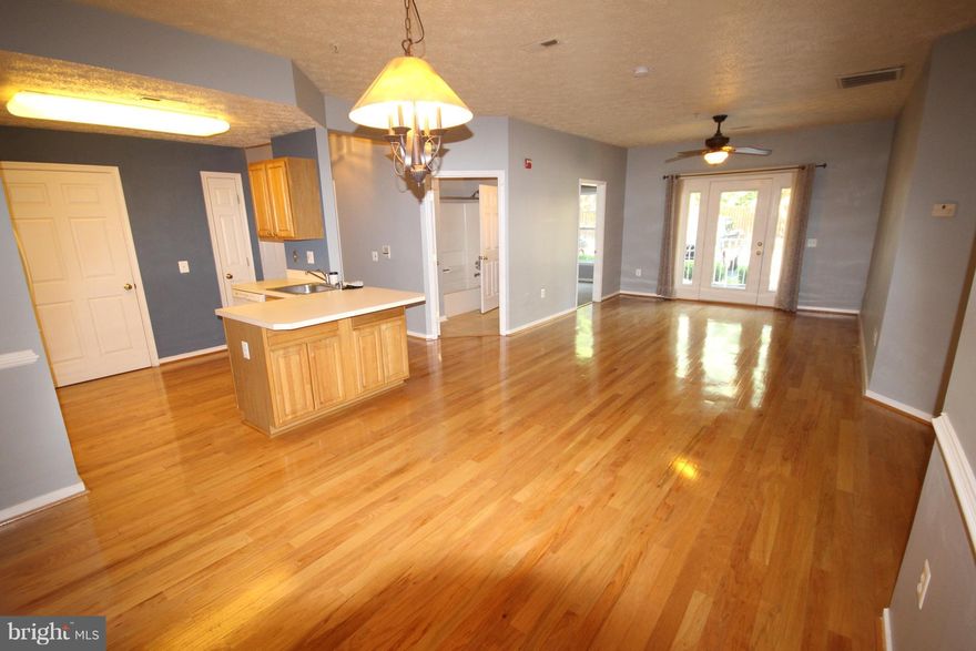 Ground level 2 bed / 2 bath Condo located at end of quiet cul-de-sac. Large entertaining balcony and spacious living room. Gleaming hardwood floors.  Both Have en-suite bathrooms and both rooms have large walk ins. Centrally located in the heart of Annapolis. Close to Mall, Hospital, Route 50 and 97. Are you ready to move in?