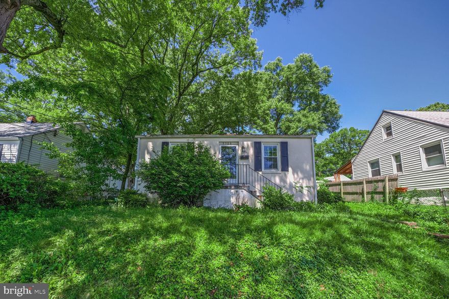 Welcome to this charming brick rambler, perfectly situated in the heart of College Park. Step into a fully fenced backyard oasis filled with already established perennial plants, including a blackberry bush and a variety of herbs—ideal for garden lovers and outdoor entertaining. 
Inside, the main level boasts two bright and sunny bedrooms, a full bath, and a cozy kitchen with a dining nook that overlooks the lush backyard—perfect for enjoying your morning coffee. The partially finished walkout basement adds even more flexibility with a third bedroom, an additional full bath, and a bonus/rec room. 
The location couldn’t be better. Just under half a mile from Greenbelt Metro, you’ll have effortless access to Washington D.C. and the University of Maryland. You'll also enjoy nearby shopping centers and of course don’t miss the local farmer’s market every Saturday—just minutes from your door. 
This home has everything you need, both inside and out.