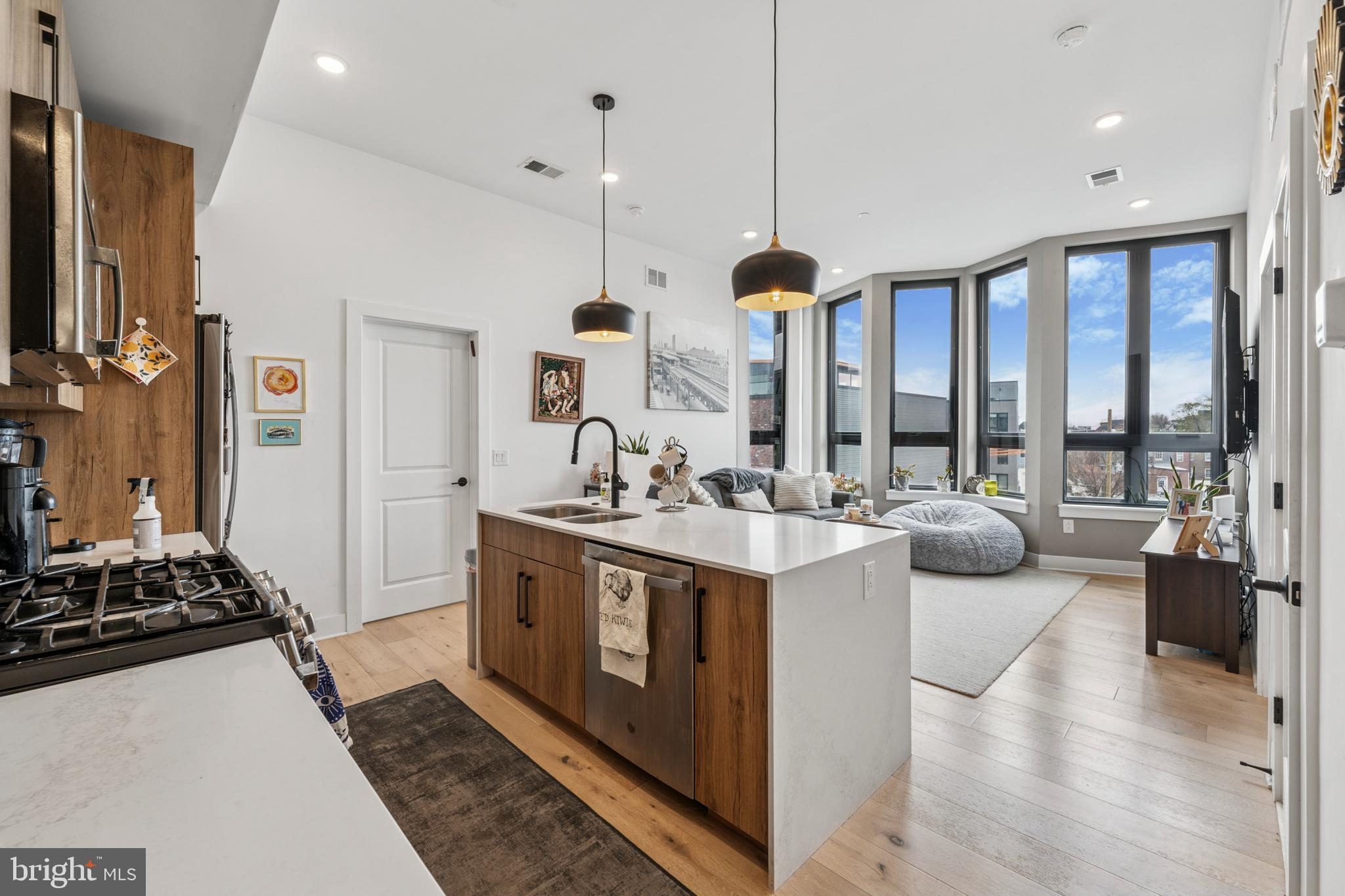 Can you hear the train? El no! Welcome to 1316 N Front Street #4A, a 2 BD/2 BA flat that is in the center of it all. From classic white oak hardwood flooring and in-unit laundry to a contemporary kitchen and sun-soaked living area, this apartment is optimized for everyday living. The main area boasts an open floor plan making it an ideal space to host small gatherings (or cook up your favorite meal while watching White Lotus Season 3). The kitchen features flat panel cabinets, a tile backsplash, stainless steel appliances, and a breakfast area for additional seating/dining. A convenient full hall bathroom is available for guests and roommates alike. There are two sizable bedrooms each with their own wing. The primary bedroom has an en-suite bathroom with a glass-enclosed stall shower. A stacked laundry unit completes the space! Central AC. Elevator access to the fourth floor. Steps from Middle Child Clubhouse, WM Mulherins and Sons, Beddia, La Colombe, Next of Kin, and more. Steps from the Market-Frankford Line. Available 6/15. Water is included. Generally, first, last, and security due upon move-in. $40 application fee. Fido is welcome!