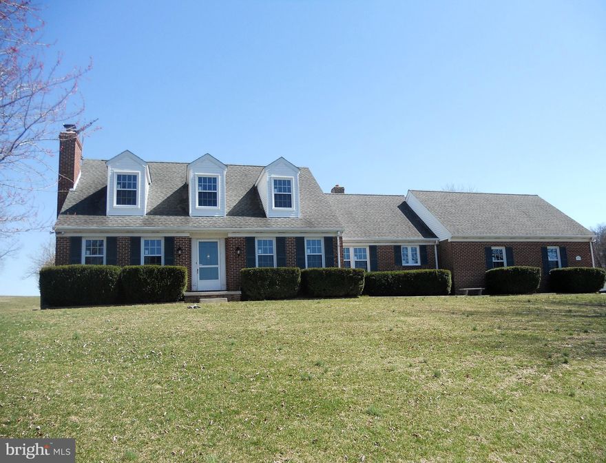 Come see this all brick 4 bedroom, 4 1/2 Bath Cape Cod with oak hardwood floors on 1st and 2nd level.Eat in kitchen with granite counters,and ceramic floors.Living room with wood stove,dining room,family room with wood stove,1st floor bedroom & full bathroom,  laundry room and 1/2 bath on main level.Finished lower level with rec room,office,and full bath and  wood stove.Brand new energy efficient windows with life time warranty and screens. Lots of storage. Situated on 2.21 acres,bordered on 2 sides by ag preservation land ,2 car garage.  Plenty of room here both inside and out!