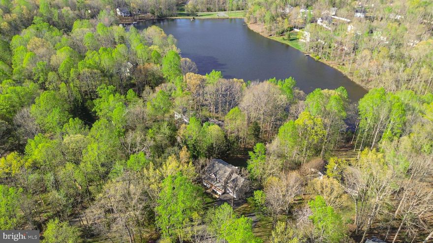 Beautiful Three-Level Colonial on the Water

Welcome to your dream home—a stunning three-level waterfront colonial offering breathtaking views from every level. Enjoy watching swans gracefully float by from the comfort of your beautiful property.

This remarkable home features 4 spacious bedrooms and 3.5 baths, perfectly designed for both relaxation and entertaining. The charming full front porch invites you to unwind and enjoy the serene surroundings. Inside, the main living areas include a living room, a cozy dining room, and an eat-in kitchen ideal for family gatherings. The family room, boasts a warm fireplace, creating a cozy atmosphere for colder evenings, enhanced by views of the water and leads to the deck. Upstairs, you will find the primary suite with a walk-in closet and en-suite bath, along with three additional bedrooms and a full bath.

The walk-out basement is finished, featuring a recreation room with its own fireplace, and provides direct access to the patio—perfect for summer barbecues or simply soaking in the tranquil views. This versatile space, complete with a full bath, offers endless possibilities for relaxation, hobbies, or entertaining.

Additionally, a spacious laundry room enhances functionality, catering to your everyday needs. With its beautiful finishes and thoughtful design, this home seamlessly blends elegance with comfort, making it the perfect oasis on the water. Don't miss the opportunity to own this incredible property—schedule a showing today!