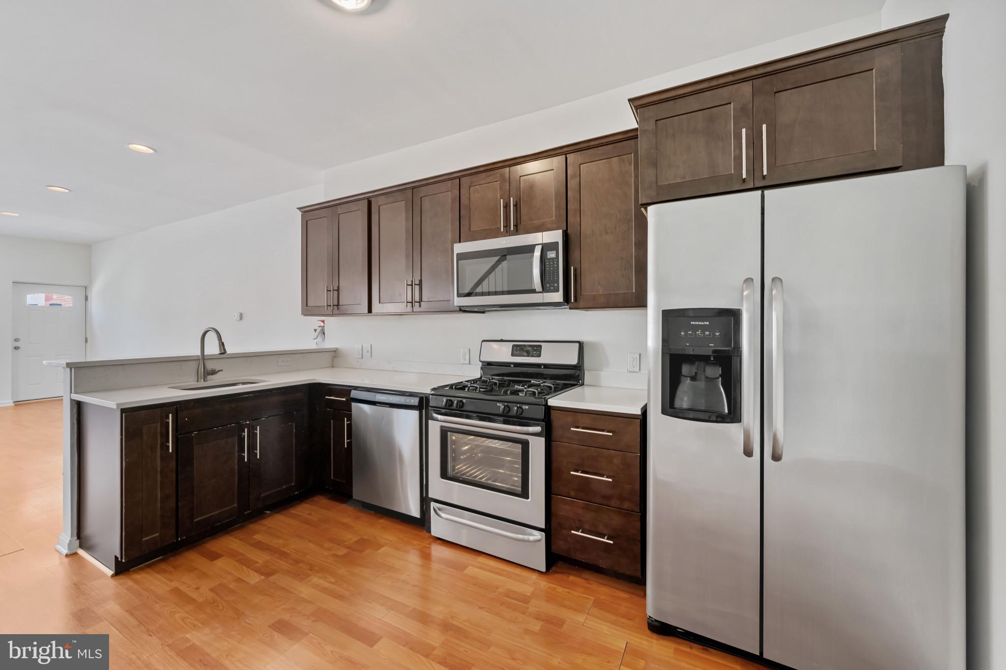 Renovated and freshly painted end-unit rowhome in the heart of Station North! This versatile property offers a main-level bedroom and full bath—perfect for guests, roommates, or added convenience. Upstairs, you'll find two generously sized bedrooms and another full bath. A fantastic opportunity for both homeowners and investors, this home has historically rented for $1,800/month. Prime location near the UB campus, public transportation, Penn Station, and all that downtown Baltimore has to offer. Don't miss this affordable, move-in-ready option in one of Baltimore’s most vibrant neighborhoods!