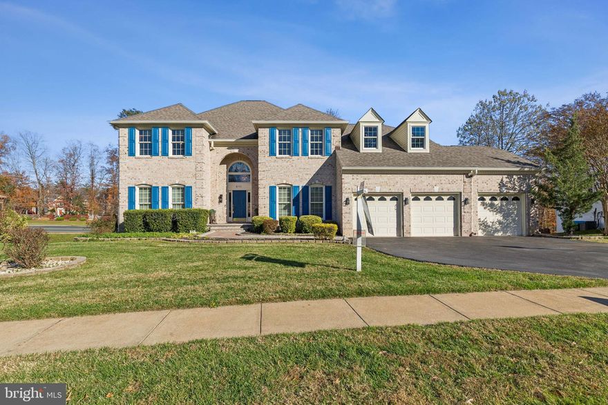 Stunning brick-front residence offering over 6,500+ sq. ft. of beautifully finished living space, perfectly positioned on nearly a half-acre backing to mature woods in the prestigious Crosspointe community. Tucked on a quiet cul-de-sac walking and biking access to Mercer Lake, Burke Lake, and Heron Pond, this home delivers an exceptional blend of elegance, privacy, and premium upgrades throughout.

A dramatic two-story foyer welcomes you with a Pecasa chandelier featuring an automated lowering mechanism for easy cleaning, an elegant hardwood staircase with custom metal balusters, detailed shadowboxing, and extensive crown molding. Brazilian cherry hardwood floors grace the formal living and dining rooms, where a second Pecasa chandelier and custom draperies convey. The main level includes 9-foot ceilings, recessed lighting, and a Nest thermostat for efficient comfort.

The fully renovated kitchen is designed for both beauty and functionality, offering 42” soft-close cabinetry with pull-out storage, quartz countertops, sleek stainless-steel appliances, a five-burner gas cooktop, ceramic tile flooring, a coffee bar, built-in desk/command station, and a butler’s pantry with glass-front cabinetry and Brazilian cherry flooring. Two custom electric blinds provide effortless light control.

The two-story great room creates an impressive gathering space with a brick-hearth gas fireplace, a stunning display area above the mantel, dual ceiling fans, and floor-to-ceiling volume. The main-level primary suite features a vaulted ceiling with recessed lighting and a fully renovated bath with heated floors, a bidet, and a ceiling fan. A library/optional 5th bedroom with Brazilian cherry floors and dark-stained crown molding sits next to an updated full bath. A second Nest thermostat serves the main level, and the washer and dryer convey.

Upstairs, three generously sized bedrooms feature Brazilian cherry hardwood floors and share two well-appointed full baths. A dedicated Nest thermostat provides zoned comfort for the upper level.

The expansive walkout lower level adds nearly 2,240 sq. ft. of additional living space, ideal for an in-law suite, au pair suite, or income-producing rental. Highlights include a second kitchen and wet bar, a large recreation/media room, a full bath, and a bonus room perfect for fitness, hobbies, or conversion to a legal bedroom with the addition of an egress window. This level also includes an updated gas furnace with automatic AC drain shut-off and a third custom electric blind.

Exterior features include updated Roof and both heating and ac units are less than 10 years old, vinyl siding, 39 premium Andersen double-pane tilt-in windows offering superior sound reduction and easy cleaning, soundproof Andersen sliding glass doors, an expansive deck, and a charming screened-in gazebo—ideal for outdoor dining and entertaining. A Vector security system (approx. $215/quarter) conveys. With HOA approval, a privacy fence may be added.

Crosspointe is one of Fairfax Station’s most desirable communities, offering two pools, the Crosspointe Swim & Racquet Club, tennis, pickleball, and basketball courts, multiple playgrounds, and miles of scenic walking and biking trails. Enjoy nearby Burke Lake Park with its golf course, driving range, boating, fishing, mini-golf, train rides, carousel, and picnic areas. The home is zoned for top Fairfax County schools—Silverbrook Elementary, South County Middle, and South County High—and offers easy access to Fairfax County Parkway, Route 123, I-95, D.C., Fort Belvoir, Quantico, and South Run Recreation Center.