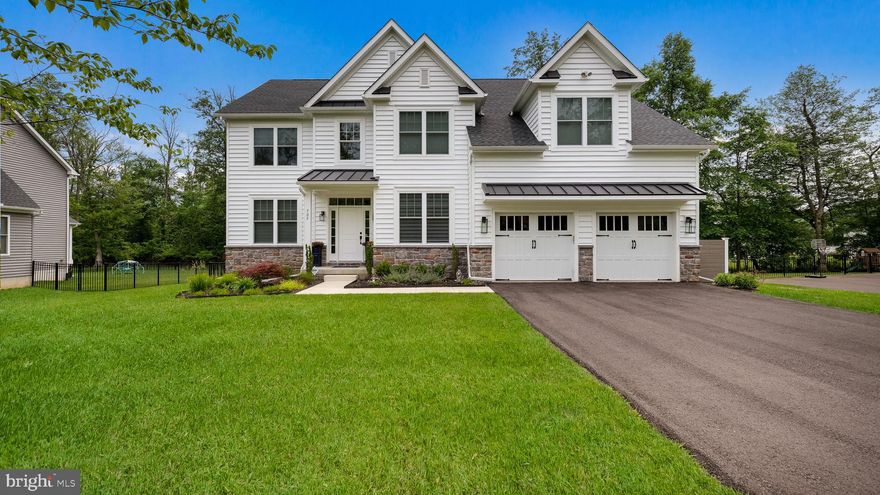 Welcome to Doylestown Woods! This stunning 4 bedroom, 2.5 bath home with a 2-car garage is just two years young and nestled on nearly half an acre in sought-after Doylestown Borough. With upscale finishes, a thoughtful layout, and a prime location, this home is move-in ready and built for both everyday living and elegant entertainment. Pull into the long driveway and take in the eye-catching exterior—highlighted by standing seam metal roofing accents, a stone water table, front & back exterior lighting and meticulous landscaping. The professionally installed lawn irrigation system ensures lush green grass all summer long. Step into the grand two-story foyer, where rich hardwood flooring flows throughout both levels of the home. A formal dining room with tray ceiling, custom trim, and elegant wall sconces sets the tone for refined gatherings. A home office, off the foyer, with double windows offers a peaceful workspace. The powder room features detailed trim and wainscoting for a stylish touch. The heart of the home is the open-concept kitchen and living area—perfect for today’s lifestyle. The chef’s kitchen impresses with a large center island, quartz countertops, custom tile backsplash, GE Cafe matte black stainless appliances (including a matching farmhouse sink), exposed hood vent, gas cooktop, wall oven, and microwave. Storage abounds with dual pantries and a beautiful butler’s pantry complete with floating shelves—ideal for barware or buffet service. The adjacent breakfast area and family room are flooded with natural light from five oversized rear windows. A gas fireplace, recessed lighting, and built-in speaker system make this space warm and inviting. Step through French doors to the custom covered porch with composite decking and wood ceiling detail—perfect for quiet mornings or lively summer barbecues. A bluestone patio adds an additional outdoor retreat for relaxing in the sun or curling up with a good book. The fully fenced backyard backs to mature woods and offer room for a future pool or expansive outdoor fun. Upstairs, the luxurious primary suite features a tray ceiling, recessed lighting, two walk-in closets with custom organizers, and a sitting area perfect for a vanity or second office. The spa-like primary bath is pure indulgence with dual vanities, freestanding soaking tub, frameless glass shower, private water closet, and beautiful tile work. A connecting bedroom off the primary is ideal for a nursery, home office, or exercise room. Two additional spacious bedrooms offer custom closets, and a stylish hall bath with dual sinks and ceramic tile rounds out the upper level. The upstairs laundry room is perfect and fully outfitted with cabinets, a utility sink, and included washer and dryer. The expansive unfinished basement offers unlimited potential—create a rec room, home gym, or movie space to suit your needs. Just outside your door, enjoy a scenic walking trail leading into the heart of Doylestown, where you’ll find shops, restaurants, and cultural attractions. Plus, moments from Routes 611, 202, and the train station—making commuting a breeze. This practically brand-new home is beautifully maintained and ready for its next chapter. Schedule your private tour today!