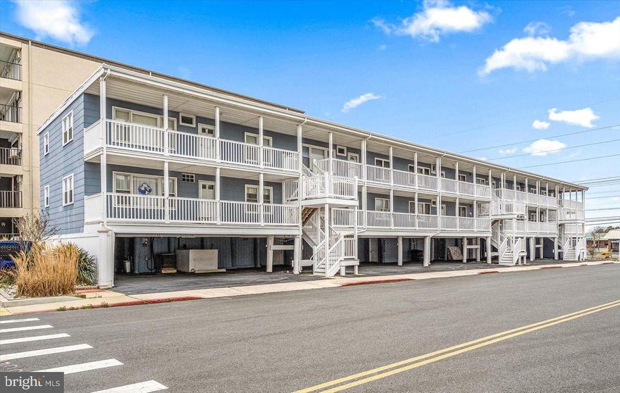 Welcome to the Atlantic Condominiums on 129th Street in sought-after North Ocean City! This 3BR/2BA condo is just steps from the beach and offers the perfect opportunity for a personal getaway or strong rental investment.
Inside, you’ll find a spacious, light-filled living room and an eat-in kitchen with abundant cabinetry. The functional layout provides comfortable bedroom space plus the convenience of private parking for two cars. A rare lower-level bonus area adds tremendous value, featuring full-size laundry, a shower, extra storage, and central AC/heat.
Just outside the front door, enjoy the expansive patio with ocean views, ideal for relaxing after a beach day or entertaining family and friends.
Walk to grocery stores, restaurants, and Northside Park, known for kayaking, paddle boarding, jogging paths, fishing piers, and the popular “Sundays in the Park” events.  This location is unbeatable.
If you’ve been waiting for the perfect property in North Ocean City, this is it!