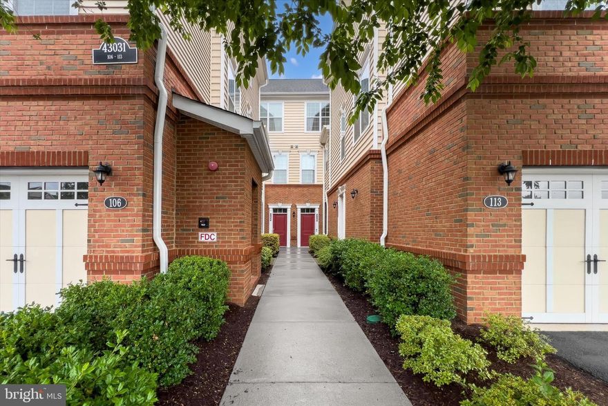 FIRST TIME RENTAL! | Beautifully upgraded 1-level Toll Brothers condo backing to serene common area | Ground-level unit—no stairs! | Wide plank hardwood floors | Gourmet kitchen with white cabinets, backsplash, SS appliances, center island & drop-down pendant lights | Family room with crown molding & TV mount | Covered patio off French doors with custom electric blinds | Owner’s suite with custom California closet, ceiling fan with light fixture & serene backyard views | Second BR with custom closet & ceiling fan | Renovated full bath with walk-in shower & grab bars | Dual washer/dryer in-unit | 2 assigned parking spots | Loudoun Valley Estates amenities: 3 pools, 2 gyms, trails, tot lots & more | Prime location near Brambleton, Dulles Landing, Metro & major commuter routes| NO PETS ALLOWED