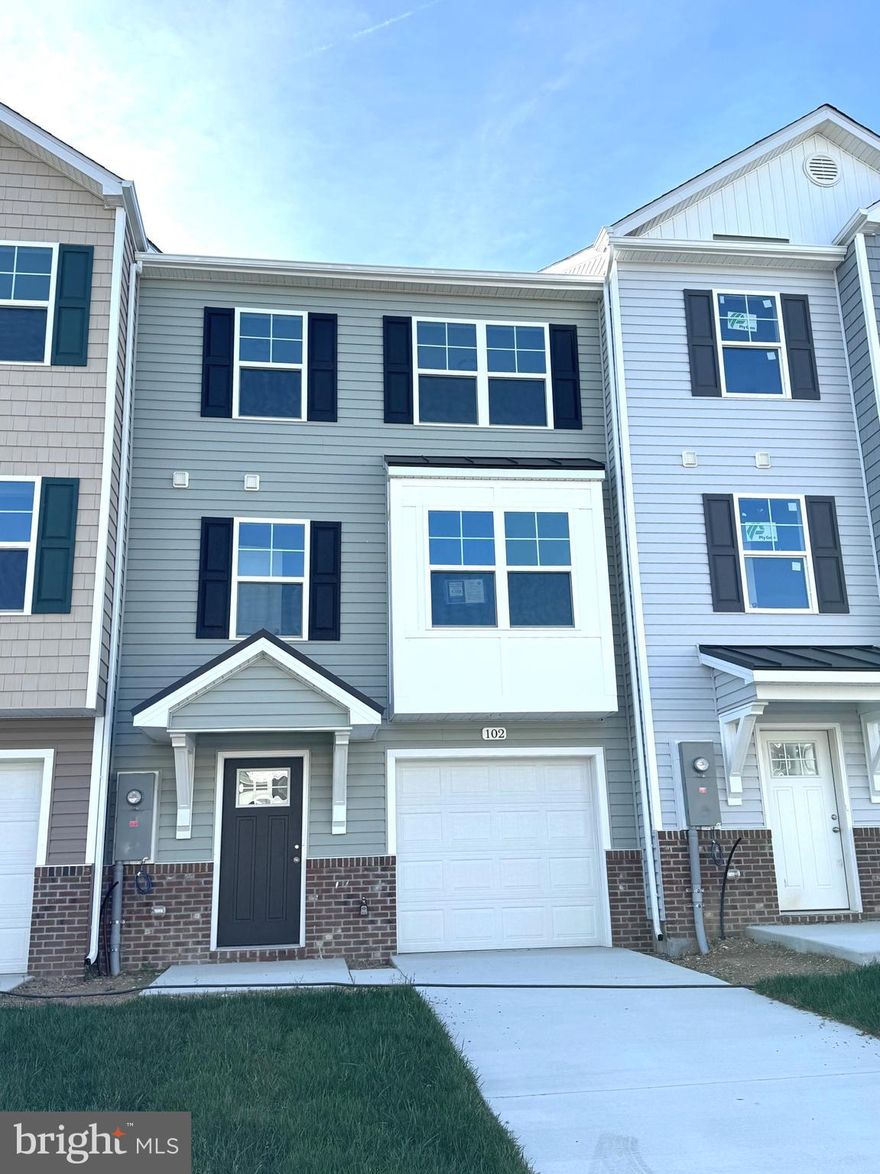 New Town Homes under construction in Heritage Hills featuring 1875 sqft of living space and Natural Gas heating. Home has bump out in main level family room, spacious open floor plan, 4 bedrooms/ 3.5 baths, Kitchen with granite countertops, separate island and island bar to family room, stainless steel appliances, and luxury vinyl plank flooring throughout the main level. The upper level primary bedroom has vaulted ceilings, walk in closet, and full bath with tile shower and glass door. The lower level offers 4th bedroom and full bath. Exterior brick on front, 10x12 rear deck, 1-car garage with auto opener, and concrete driveway included.