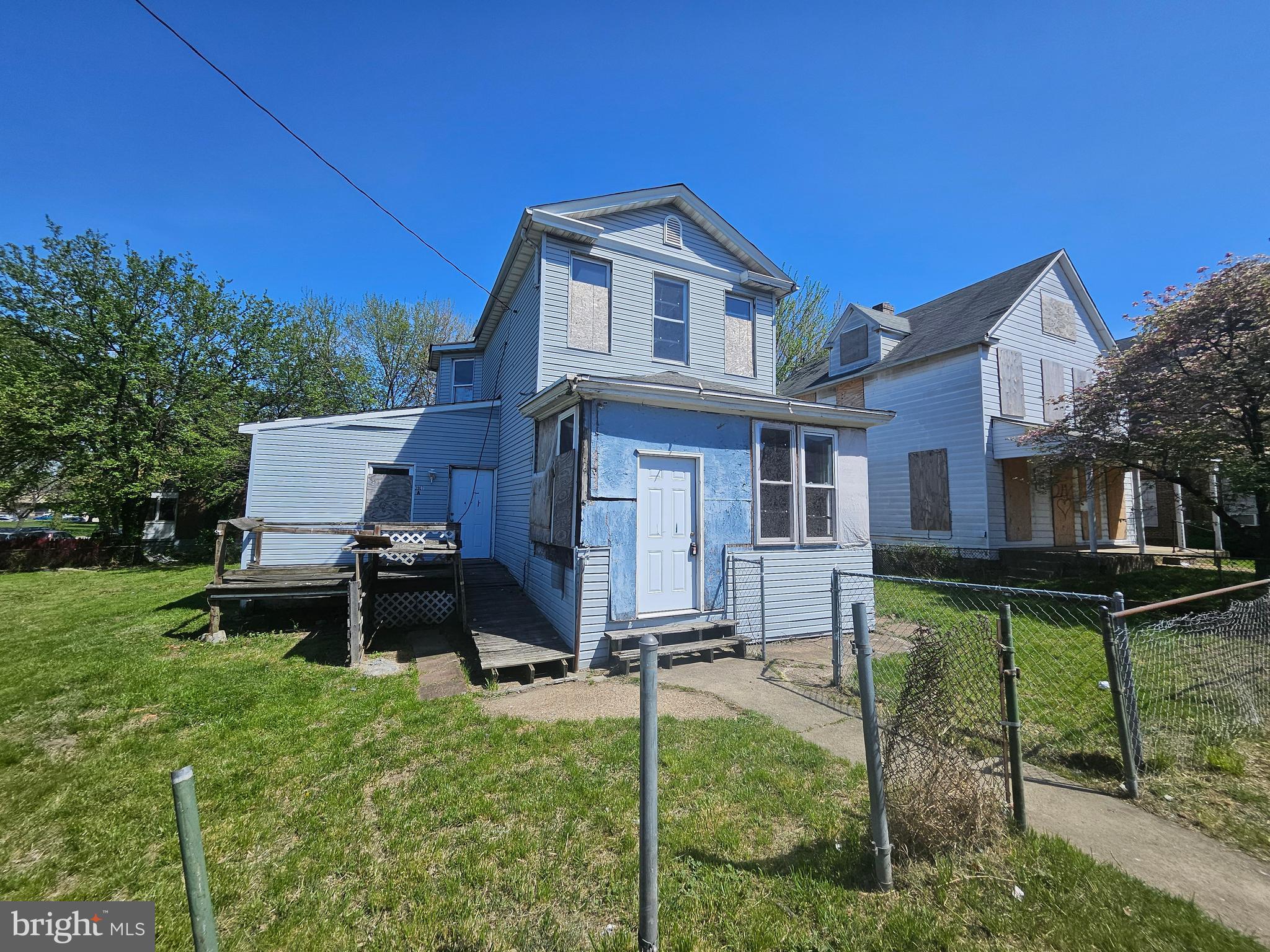 This is a Fannie Mae foreclosure. Restore this 2 unit detached home or take advantage of the corner lot and do something more. This property is mostly fenced, across from the local park with quick access to the city and county. The current structure is 2 units. Unit 1 is a 2 bedrooms, 1 bath, living room, kitchen and basement. Unit 2 has a bath area on the main, another bath on the upper level with 3 bedrooms and kitchen area.