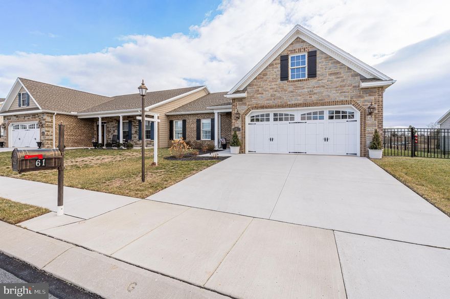 Step into a home that feels just right. This beautifully maintained 2-bedroom, 2-bath villa offers the perfect blend of warmth, space, and thoughtful upgrades. Whether you're looking to downsize or enjoy one-level living in style, this home offers the comfort and simplicity you deserve.

💛 What makes it special:

• A spacious owner's suite with calming pond views, a large walk-in closet, and an easy-access bathroom featuring a huge walk-in shower. The Primary has direct access to the laundry room for added convenience
• A second bedroom at the front of the home, perfect for overnight guests or visiting family, with its own walk-in closet and nearby full bath
• A cozy living room with a gas fireplace where you can unwind with a good book or spend quiet evenings with loved ones
• A gorgeous kitchen with upgraded cabinetry, soft lighting, stainless steel appliances, Corian countertops, and a large island that makes meal prep easy and enjoyable. Stove and microwave are convection and the farm sink is huge!
• A sunny breakfast area and cheerful sunroom that fill the home with natural light and warmth
• A flexible front bonus room that can be used as a library, craft space, or quiet reading nook
• Luxury plank flooring throughout, paired with soft lighting and an open layout that’s easy to move through
• An attached two-car garage, a dedicated laundry room, and a separate storage room that keeps everything within reach without clutter
• A beautifully landscaped backyard with a private patio where you can sit and enjoy the gentle breeze and peaceful views of the pond

This is low-maintenance living at its best. No stairs. No stress. Just a peaceful, well-designed home with all the space you need and none of the hassle. From the upgraded finishes to the serene setting, everything here was made with comfort and convenience in mind.

If you're dreaming of a home where you can relax, recharge, and enjoy every day with ease, come see the magic of 61 Stoners Ave. Your next chapter starts here.