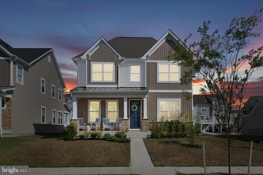 This stunning residence shows like a model home and offers the rare advantage of being better than new. Situated within walking distance to the community center, pool, and playground in the amenity-rich Stonehaven community, this two-year-old home was freshly painted just last year and is loaded with luxury upgrades throughout. Spanning over 4,000 square feet, the expansive floor plan features five bedrooms and four and a half baths, providing ample space for living and entertaining. Upon entry, a light-filled foyer flows into an elegant formal living room and a large dining room designed for hosting. The main level is further enhanced by a half bath with a pedestal sink and gorgeous new tile flooring.

The heart of the home is an open-concept family room with a gas fireplace that connects seamlessly to a gourmet kitchen. This chef’s space is equipped with a large eat-in island, granite countertops, stainless steel appliances, under-cabinet lighting, and new pendant fixtures. Adjacent to the kitchen, a bright breakfast area features decorative wall molding and leads to a mudroom providing access to the two-car garage—complete with epoxy flooring—and a fully fenced backyard.

The upper level is defined by an enormous primary suite accessed through French doors, featuring a tray ceiling, a private sitting area, and rich hardwood flooring. The suite’s massive walk-in closet includes custom built-in shelving and a new chandelier, while the primary bath offers a double vanity, a walk-in tiled shower with a bench, and a large linen closet. A secondary primary suite with its own private full bath provides excellent flexibility, while two additional large bedrooms with walk-in closets share a well-appointed hall bath with a double vanity. A convenient laundry room completes this level.

The fully finished walk-out basement is a true standout, featuring a custom-built bar with granite countertops and a wet bar with adjustable lighting installed only three months ago. This level also includes a fifth bedroom, a full bath, an enclosed office with glass doors and hardwood floors, and a utility room perfect for a home gym or extra storage. Modern comforts abound, including a tankless hot water heater, a full sprinkler system, recessed lighting, crown molding, and upgraded matching light fixtures throughout. Perfectly located near premier shopping, dining, and commuter routes, this home offers a unique opportunity to own a turnkey masterpiece at an exceptional value. Book your showing today.