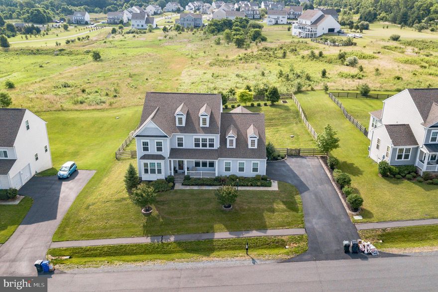SIMPLY STUNNING home in sought-after Historic Selma! This 8 year old home has it all.... with over 150k in upgrades during and after build/ gorgeous custom blinds. The details are endless in this 6 bedroom/5.5 bath home with hardwood floors throughout the entire first floor and second floor. The main-level primary bedroom has giant windows inviting you to wake up every morning and take in the nature preserve in the backyard....your own piece of heaven. The stone-covered gas fireplace in the living room is a conversation hub. The gourmet kitchen is a chef’s dream and great for entertaining...it includes carrera quartz-countertops and marble backsplash / tons of cabinets / copper extra-deep sink/ under-the-cabinet lighting. Butler’s pantry has matching countertops. Working from home never looked so good .....you won't want to leave. Just wait until you see this main level study with elaborate built-in library from floor to ceiling, and the solid custom barn door to enclose the space when you demand privacy. Every room is spacious and is the perfect combination for gathering with friends and family. The kitchen and great room flow to the generous Trex deck and Pergola you’re sure to enjoy spending time on. ... and let’s not forget the stairs that takes you or your puppy to the yard through the new paver patio. Upstairs has so much to offer as well: 4 bedrooms and 3 full baths. Enormous closets are found throughout the entire home!  Storage will be no problem here. The walkout basement has an in-law suite you simply must see! Custom tile work, niche, your guests may over-extend their stay! Oh and storage space!  Currently the Costco room with plenty of shelving doubles as the home gym.  Lock-down has never been easier, bring on the workout gear! Large open recreational space is great for year-round entertaining, ping pong, foosball, you name it.  Are you tired of the word “custom” yet?  Well, the basement’s wet bar with locally sourced black walnut live-edge bookend slabs fall in that category, too. All chandeliers in except for the Master Closet one convey, yes, even the Restoration Hardware Wine Barrel! The yard is kept looking great with the sprinkler system. The HOA pool is open and it is sparkling and located on the next street. Don't miss the opportunity to make this your dream home.