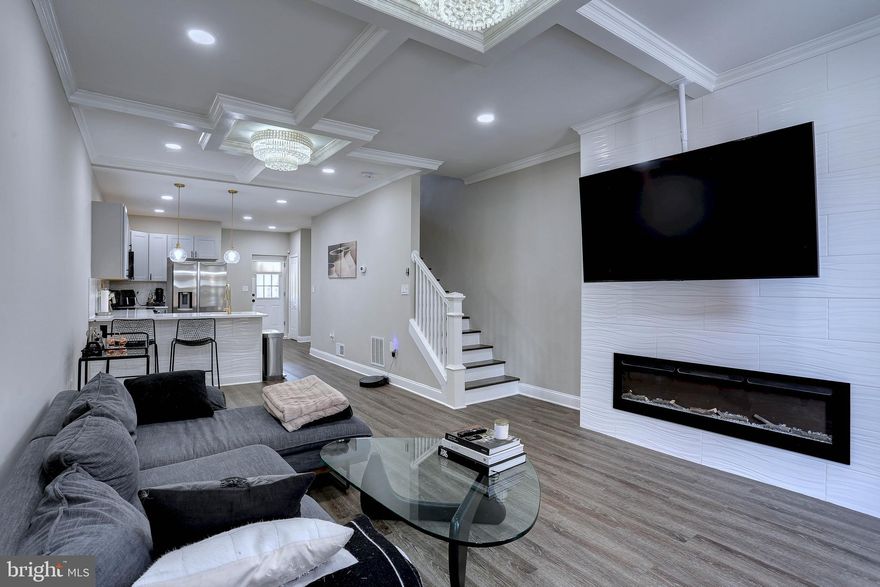 Spacious City Living in the Heart of Union Square!

Welcome to 109 S Calhoun St, where charm meets modern living in over 2,000 sq. ft. of beautifully designed space! This stunning home features a bright open floor plan with custom moldings and stylish lighting throughout. The inviting living room with an electric fireplace sets the tone for cozy evenings, while the gourmet kitchen is a chef’s dream — complete with Quartz countertops, stainless steel appliances, and a breakfast bar perfect for casual meals or entertaining guests. Enjoy added convenience with a main level half bath, and flexible living across three levels. The second floor offers 2 bedrooms, a full bath, and a spacious sitting area, while the third level features an additional 2 bedrooms and another full bath — ideal for guests, office space, or a growing household. Need more space? The finished basement delivers with a large family room and half bath, perfect for movie nights, a playroom, or home gym. Step outside to your covered rear porch, the ideal spot to unwind or entertain, overlooking a private fenced yard. Don’t miss your chance to own this exceptional home in the vibrant Union Square neighborhood — full of history, charm, and community energy!