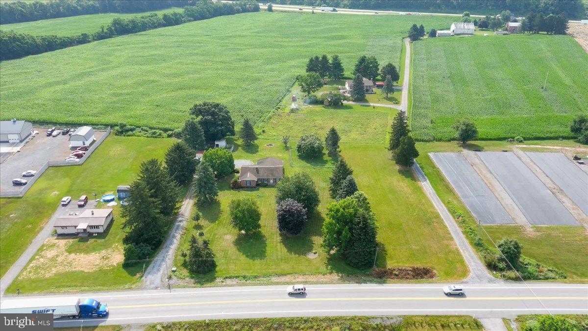Rare opportunity to acquire a high-exposure commercial site totaling 3.2 acres in Shippensburg, PA. This offering includes two separate residential parcels being sold together, both zoned **C-1 Commercial**, allowing for a wide variety of permitted uses—retail, office, restaurant, warehouse, mixed-use development, and more.
Located right off the Fayette Street exit of I-81 and positioned on Olde Scotland Road, this site sits in the heart of a rapidly expanding commercial corridor—surrounded by major distribution centers (Walmart, Procter & Gamble), Sheetz, and other national and regional businesses. Excellent visibility, strong traffic counts, and easy highway access make this an ideal location for investors, business owners, and developers looking to establish or expand in a booming market.
Both parcels are being sold together with **no exclusions**. Existing homes can be repurposed or removed for full site development. Opportunities like this are extremely limited in this area—secure your footprint today.