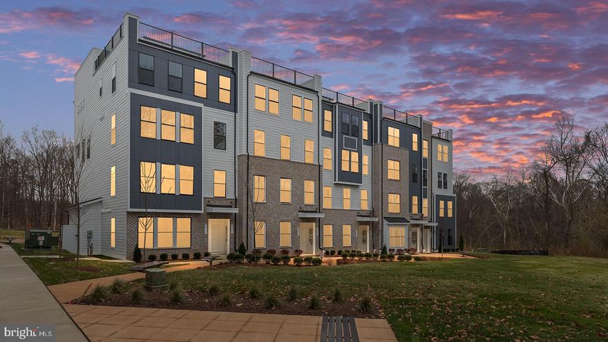 **OFFERING UP TO 20K IN CLOSING COST ASSISTANCE WITH USE OF APPROVED LENDER AND TITLE.**
Enter the Clarendon from either the main front entrance or the private entrance through the rear garage. Both entry points lead to the main living level which opens to the dining room and an adjacent powder room. The center kitchen showcases an open design with upgraded stainless steel KitchenAid Appliances, a pantry, and an oversized 12' island. Continue to the rear of the main level, where the great room seamlessly connects to an outside covered lanai. The primary suite includes an enormous walk-in closet and an ensuite bath equipped with a dual sink vanity, a walk-in shower with a seat, frameless shower door, two shower heads, and a private water closet. Additionally, there are two generously sized secondary bedrooms, a full bath with a dual sink vanity, and a conveniently placed laundry room on the upper level with a wash basin and included washer and dryer. Enjoy scenic nature views from your rooftop terrace in the last nature preserve view building at Kincora!