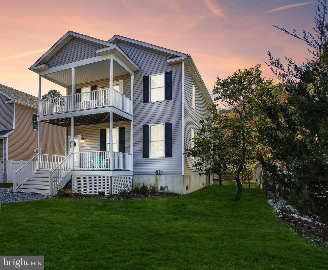 CHESTER RIVER BEACH!!The Water Accessible Neighborhood of "Chester River Beach" has a HOT NEW listing! IMMACULATE and MOVE-IN-READY with nothing to do but sit back and relax! This spacious 3 Bedroom , 2.5 Bathroom, Carolina Style Colonial was Custom Built in 2014 and has fresh new paint and trim! Stunning Hardwood Floors gleam throughout the main level which hosts the Family Room, Powder Room, Large walk-in Pantry and the Eat-In Kitchen. Upgraded Kitchen with expansive Granite Countertops, Granite Island, Stainless Steel Appliances, Custom pull-out drawers to house large pots and a Double Oven... all of which is surrounded by Beautiful upgraded 42" Cabinets! The Primary Suite has a sitting area, Cathedral Ceiling, Walk-In Closet, Tiled walk-in Shower and a private Balcony with Winter WATERVIEWS! Upstairs there are 2 other Large Bedrooms, a hallway full bath, and a pull down attic. Spacious Laundry Room too! The front porch, upper balcony and HUGE rear deck are great spots to enjoy the Chester River Breeze! Massive 24X24 Detached 2 level Garage with upstairs space that is perfect for a home office has ample opportunities for storage... so bring those cars, toys, trucks, kayaks, SUPS and bikes! Enjoy the fully fenced in back yard and luscious green grass space! All new fresh stone driveway that is generous in size and will easily fit many cars and boats!! Neighborhood has Private Boat Ramp, Fishing Pier, Boat Slips, Beaches, Pavillion, Park Benches, Kayak Storage and Playground! Community Events to include, Chili Cookoff, Halloween party, Movie nights at the Beach, 4th of July Parade, Easter Egg Hunt and more! Super close to the Cross Island Trail, Kent Narrows, Shopping, Restaurants, Outlets and easy to get on and off RT 50. Commuters Dream! Easy Boat ride to Rockhall, Corsica River, Conquest Beach, Chestertown, Narrows, Eastern Bay and St. Michaels! Enjoy some of the best crabbing and fishing here on the Chester River! **Welcome to 607 Chester River Beach Road**
