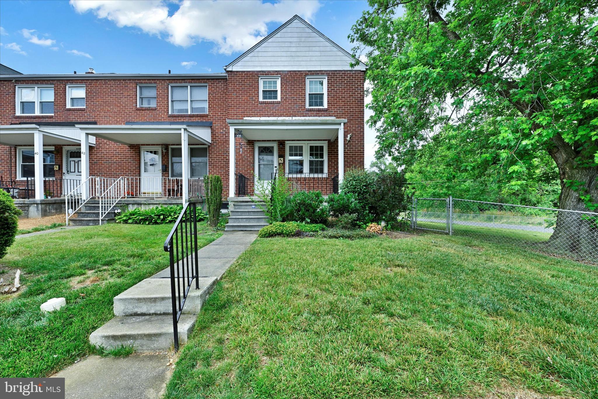 Well loved end of group townhome in Towson - move-in ready! Entertainers will love the warm and inviting feel of the gleaming hardwood floors and exposed brick accents throughout the main level. The living room features beautiful hardwood flooring just off the dining room. The kitchen has great counter and cabinet space! The upper level boasts 3 bedrooms and one full bathroom with beautiful custom tile flooring. The lower level is fully finished with gorgeous flooring in the family room. This space would make a great place for a home theater or gathering space. There is also a storage area and laundry room on this level.
Enjoy grilling out on the deck that overlooks the backyard and side yard! Wide and open space perfect for gatherings and a bonus for this end of group townhome. Fully fenced with parking pad in back of the home and a shed for storage.