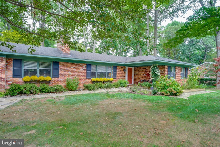 OPEN SUN 12-2! Stunning  2 BR, 2 BA ALL BRICK Rancher with exquisite natural park-like setting in premier community of Annapolis Roads.  Renovated with arts and crafts decor, custom built ins,lovely stone dual fireplace, large room sizes, screened porch, gorgeous deck, lush landscaped corner lot & more!  Enjoy ONE LEVEL living and superb beach privileges. Call CSS to show. Updated photos coming!