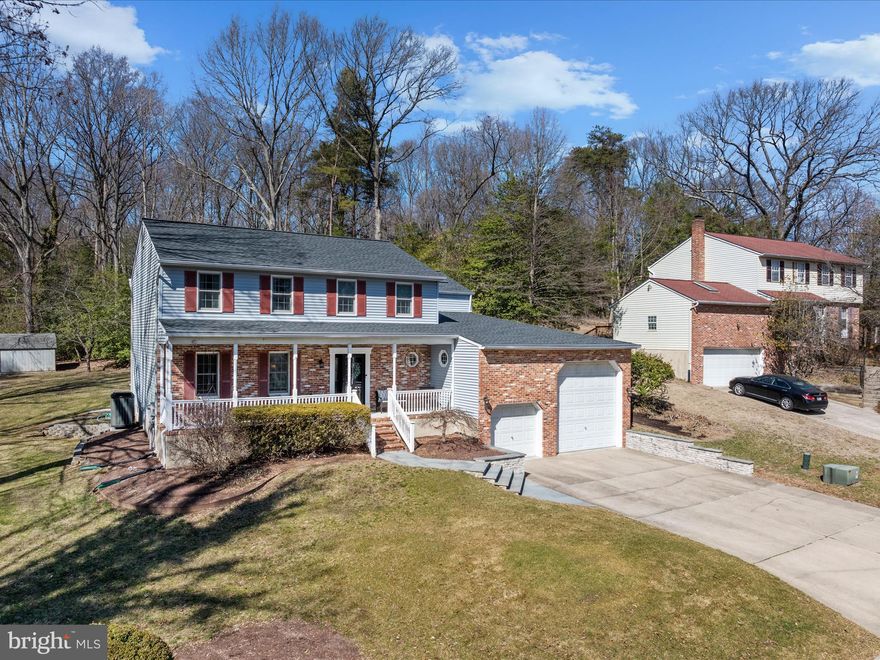 Welcome to this inviting, well cared for colonial in a prime location on a no-through street in the ever popular Fairwood community! The home features 4 bedrooms, 2.5 baths, and a two story addition which adds a beautiful two story family room with floor to ceiling brick fireplace flanked by windows, a loft area overlooking the family room, an office and flexible space perfect for a media room or additional study. The primary bedroom has a private ensuite full bath. Each room in this home is generously sized including the large kitchen and adjacent dining room. A deck off of the main level overlooks a beautiful .46 acre lot backing to woods. The finished lower level has new wall to wall carpet & provides additional living space with a walkup exit to the rear yard. The attached 2 car garage has 2 bays, one of which is 12' tall to store up to a 35' recreational vehicle. Relax on the full front porch and enjoy views of the mature trees on this idyllic street. Voluntary HOA amenities include a community park, playground and large community pool. Fairwood holds community events including a 4th of July celebration, Halloween party, Easter egg hunt and movie night. Recent updates include roof and skylight (2020), high efficiency top of the line Trane HVAC (main section of home, 2022), windows in main home (2010), front door and basement windows (2022), crawl space encapsulation (2023), & brand new hot water heater. Don't miss this incredible opportunity to live on a peninsula with quick and easy access to local shopping, restaurants, multiple waterfront parks, marinas, public boat launch, Baltimore, Annapolis & Ft. Meade.